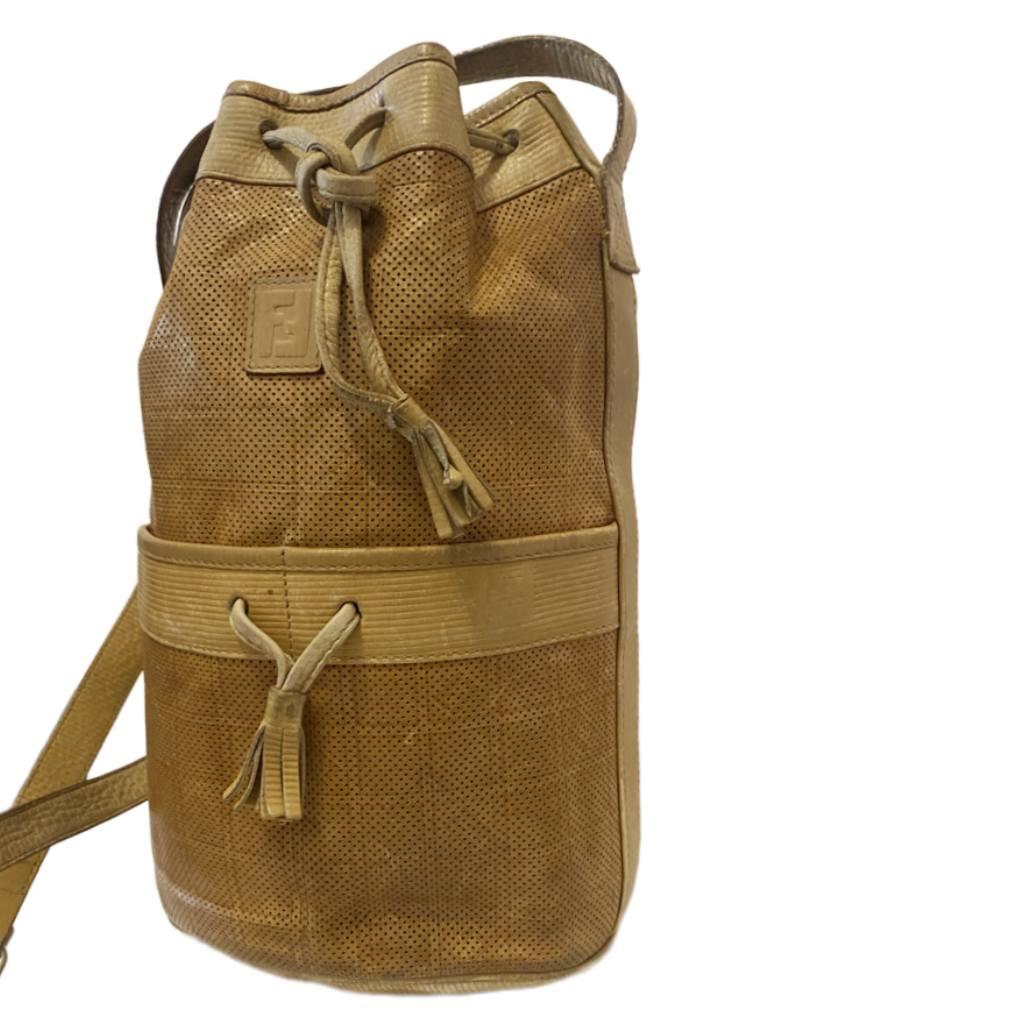 1980s Fendi Beige Brown Tall Leather Bucket Bag, top lace closure, inside black leather, zipped inside pocket, leather adjustable strap with buckle, Made in Italy 

Condition: 1980s, vintage, good with sign of wear, condition true to images