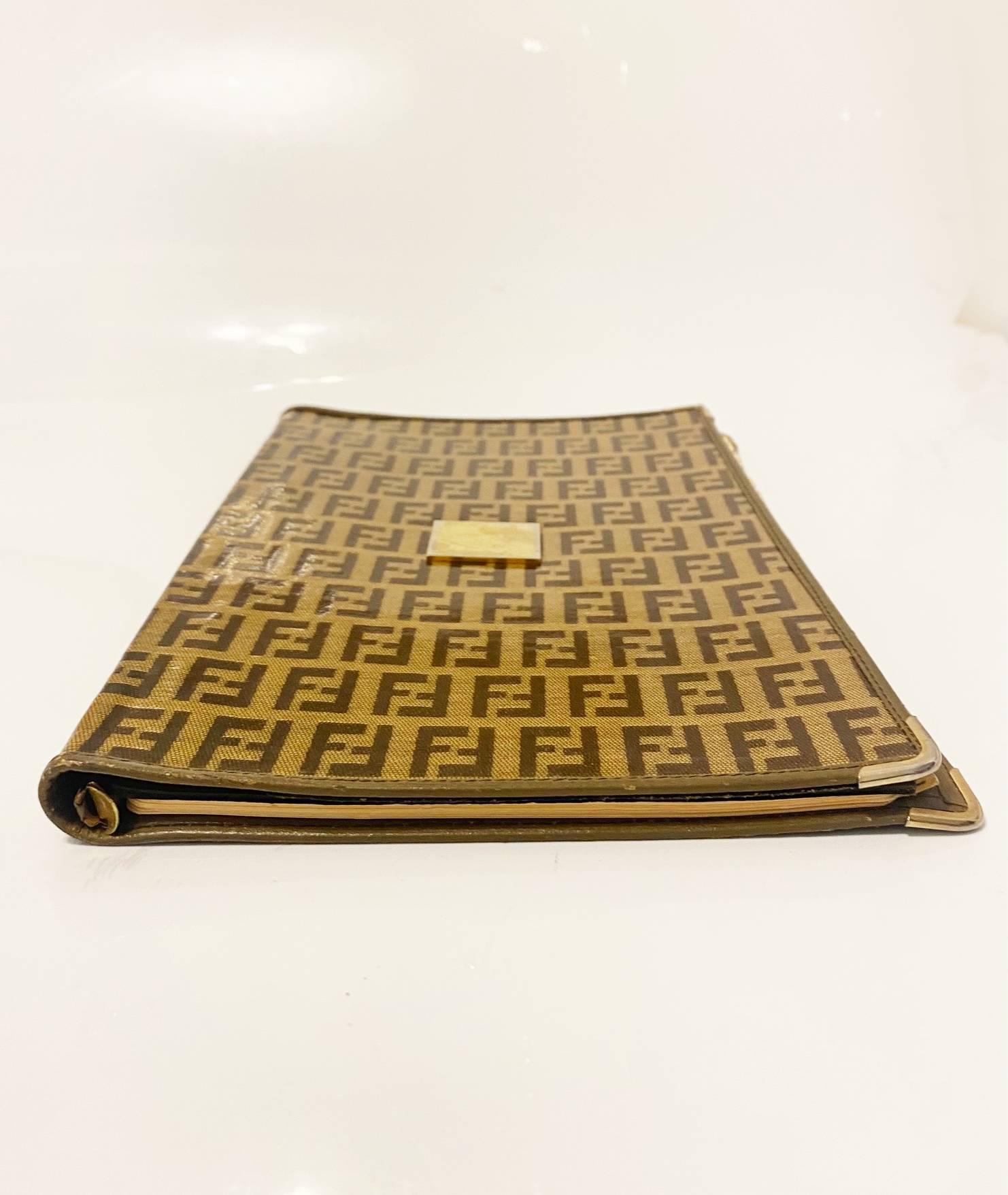This 1980S Fendi Zucca Address Book is a sophisticated and timeless piece from the exemplary Italian house. Crafted with exquisite attention to detail, this address book features a Zucca print and front gold tone tag against a classic Italian