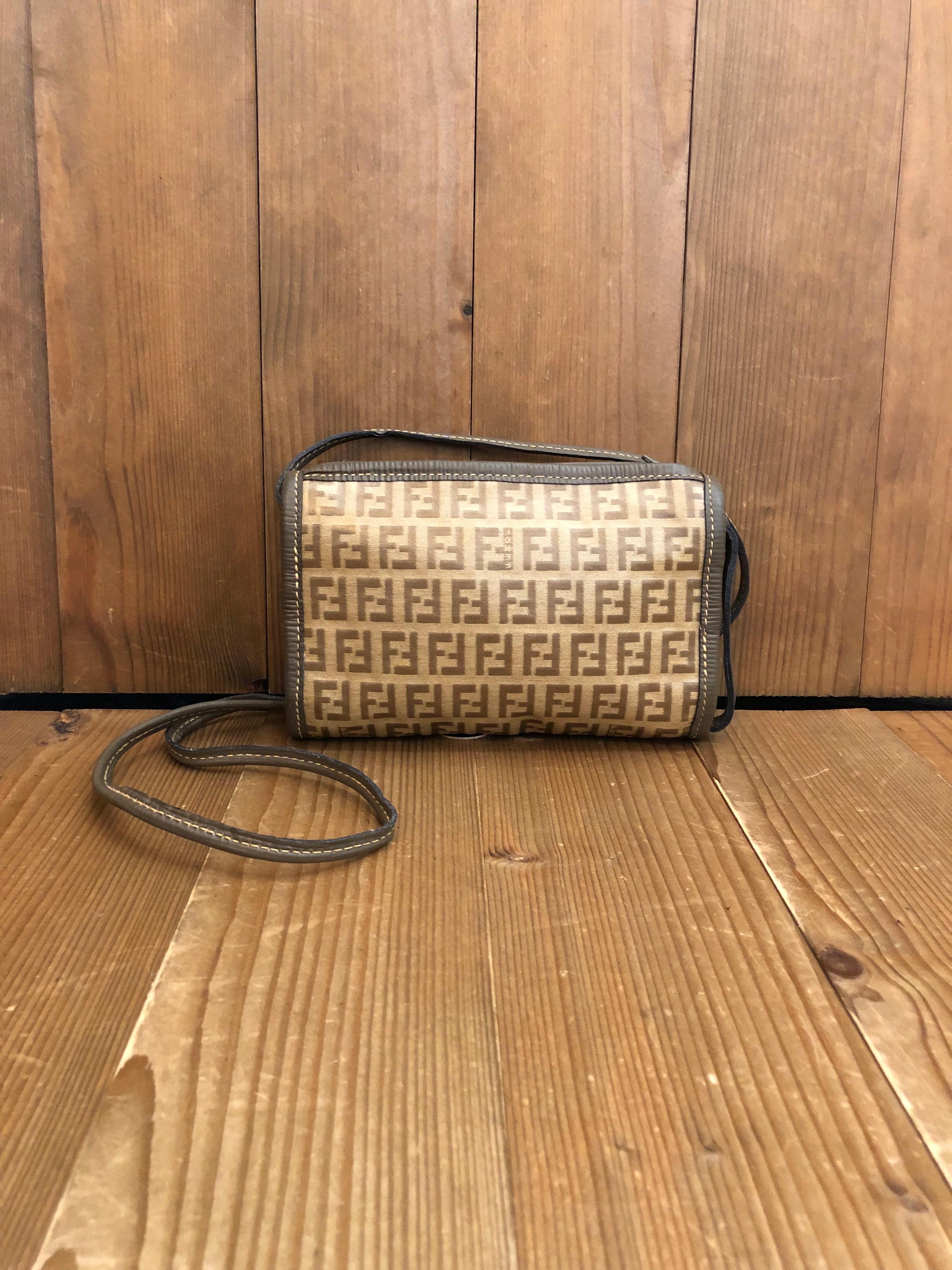 This vintage Fendi Zucchino mini crossbody bag is crafted of Fendi’s iconic Zucchino coated canvas in brown.
Made in Italy. Measures approximately 7.25 x 4.5 x 1.5 inches Drop 22 inches. 

Condition: Minor signs of wear. Generally in good condition.