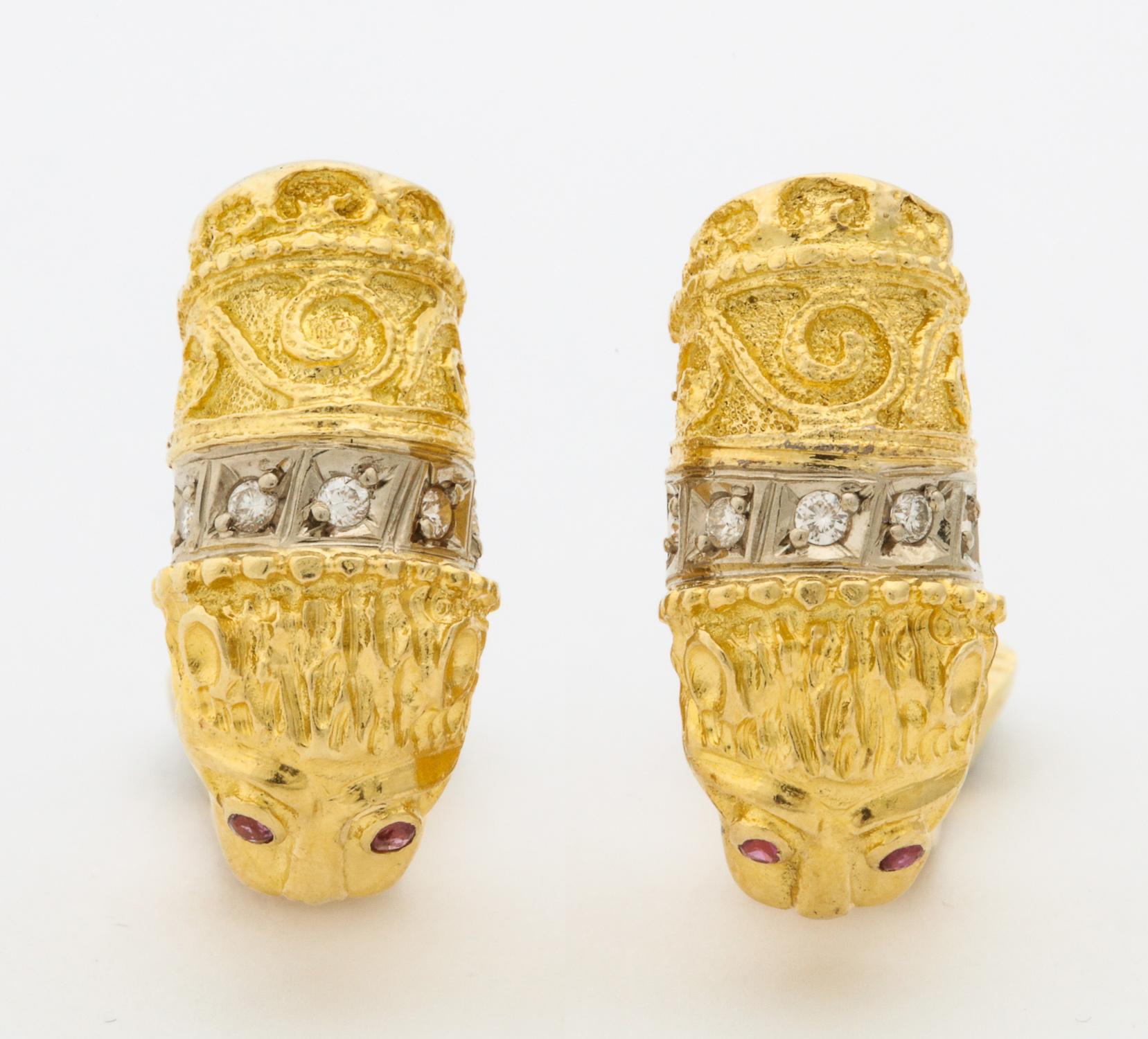 One Pair Of Ladies 18kt Textured Yellow Gold Earclips With Posts,Designed In A Figural Lion Motif And Embellished With 10 Full Cut Diamonds Weighing Approximately .30 cts Total Weight. Lion Earrings Are Also Embellished With 4 Faceted Rubies