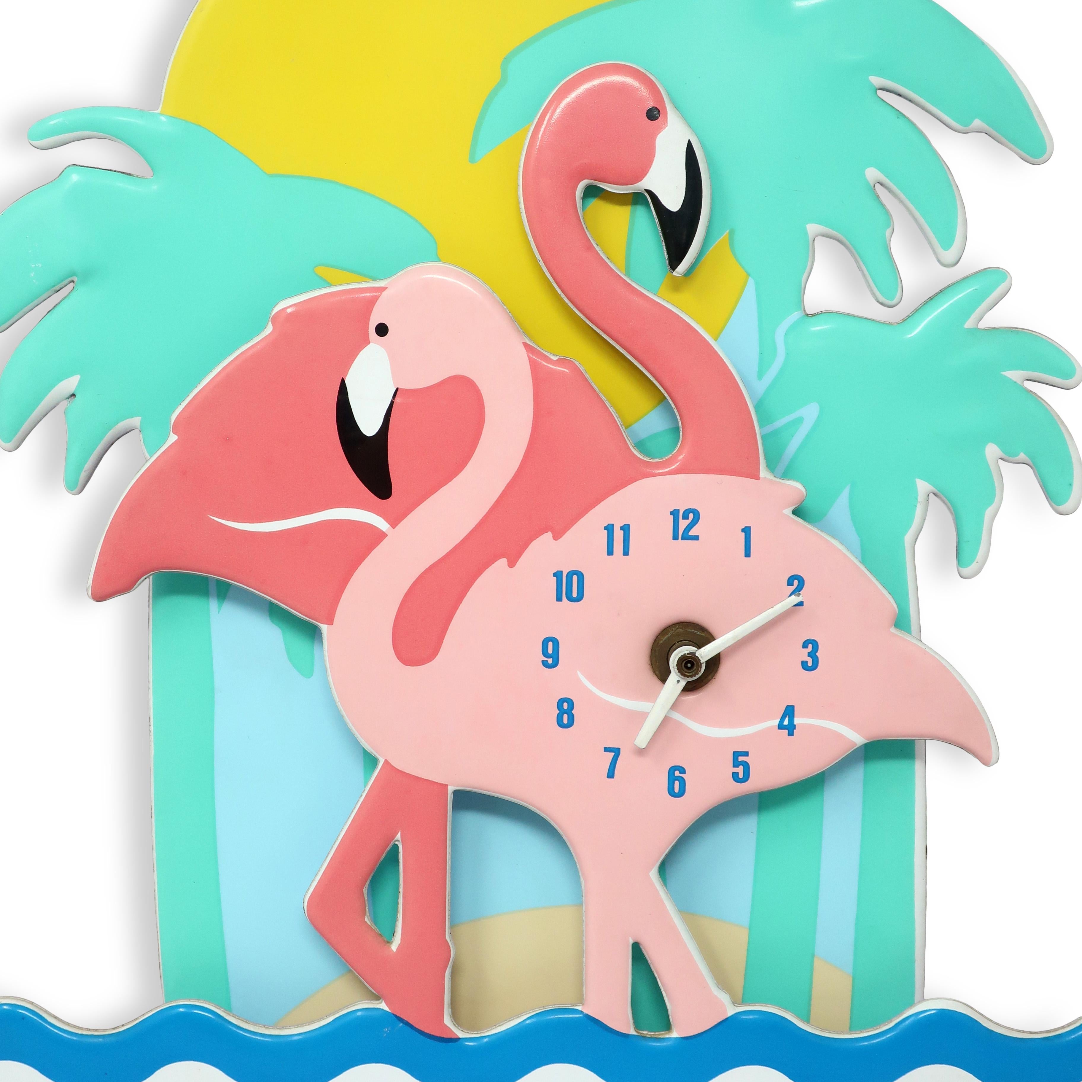 Bringing a touch of whimsical charm to any room, this vintage flamingo wall clock by Small World Greetings is a delightfully elegant, and very 1980s Miami Vice, in pink, blue, aqua, yellow and white

In good vintage condition with wear consistent