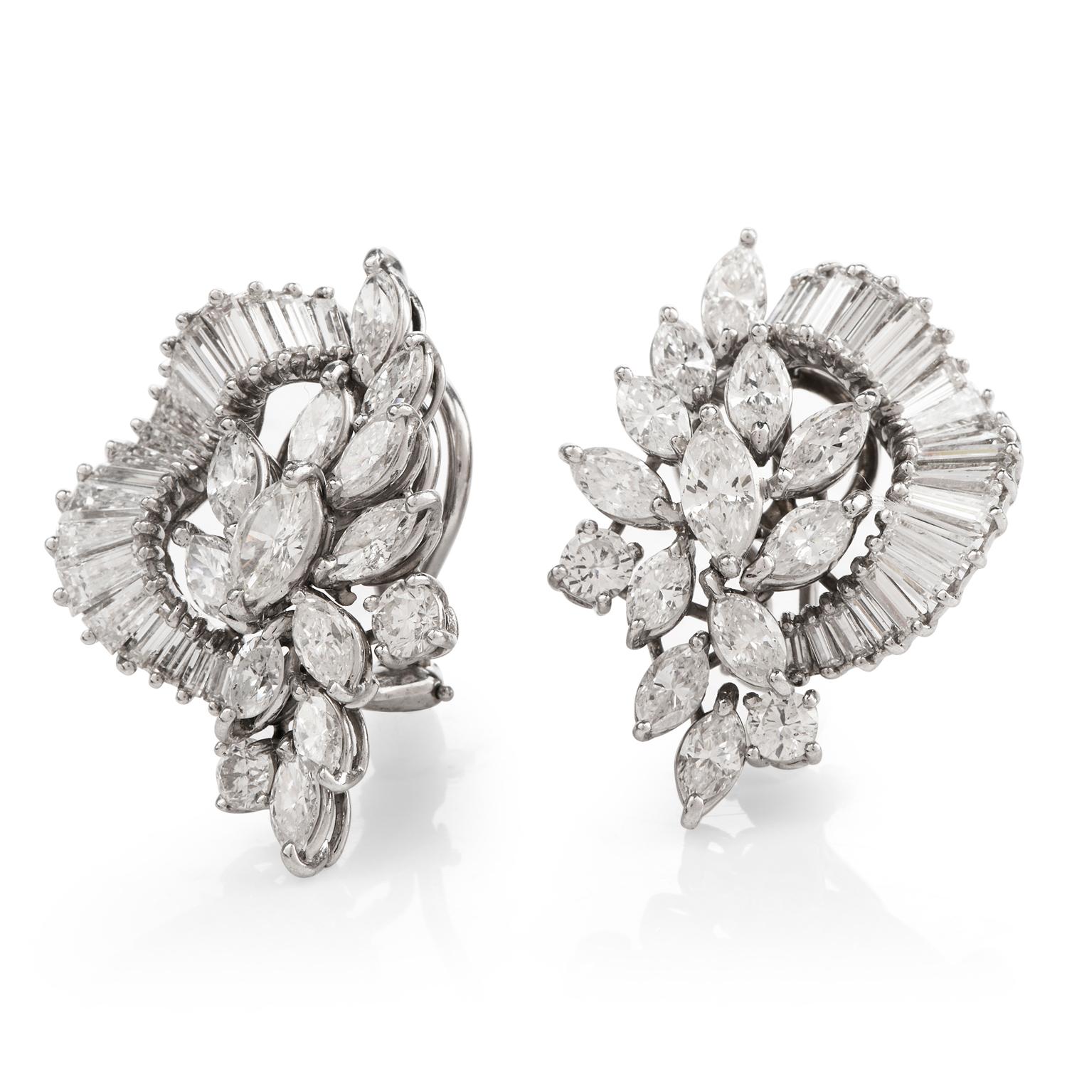 These shimmering diamond clip-on earrings are crafted in solid platinum weighing 18.5 grams and measuring 31mm long x 30mm wide. Displaying 24 marquise diamonds prong-set in a leaf-like pattern, collectively weighing approximately, 6.15 carats,