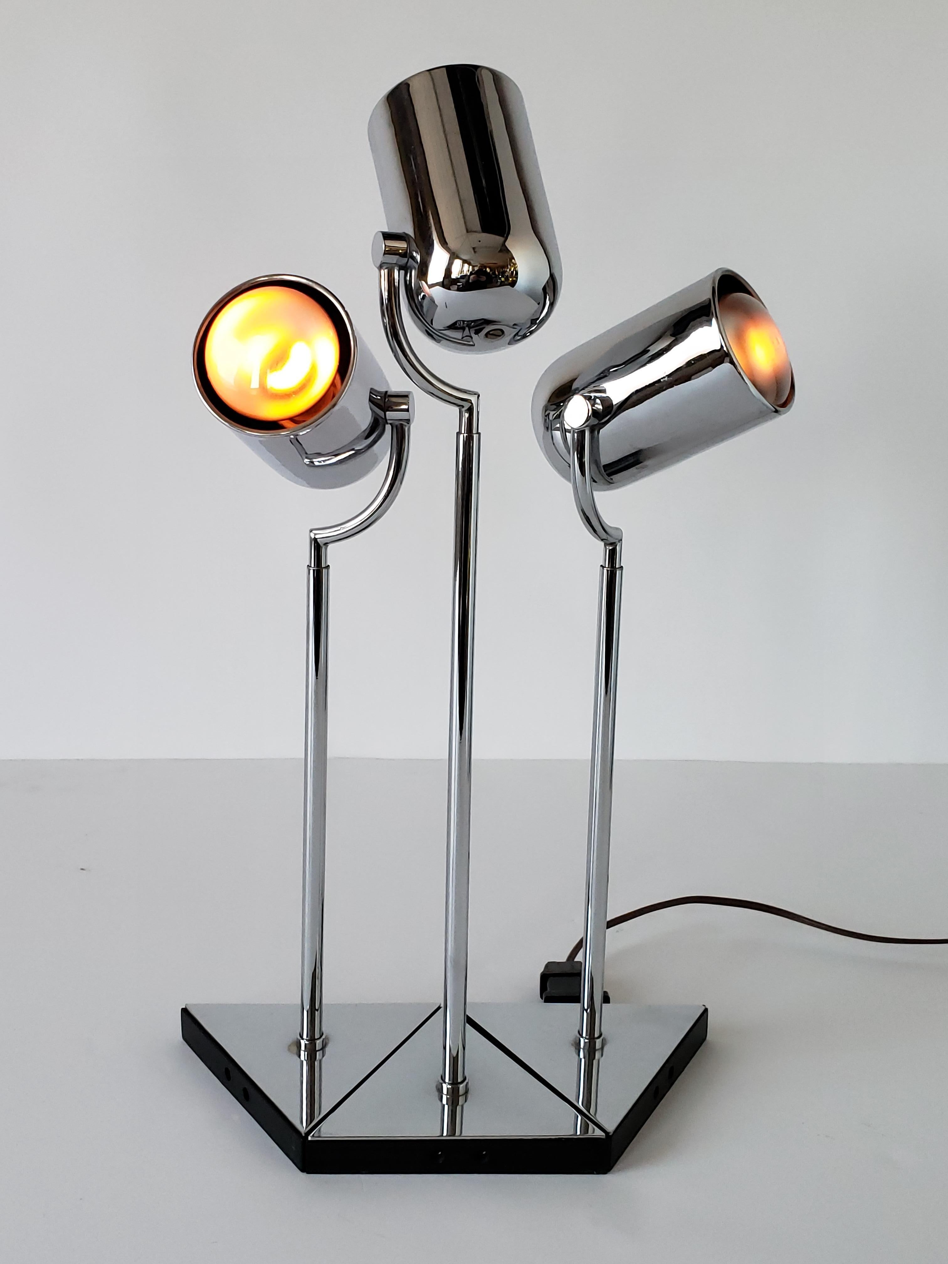 Rare Florence Casey chrome modular table lamp. 

Triangle base are interconnectable.

Chrome heads pivot left to right, up and down.

Socket are European E14 base. Come with reducer from E14 to North American E12. 

Signed item.