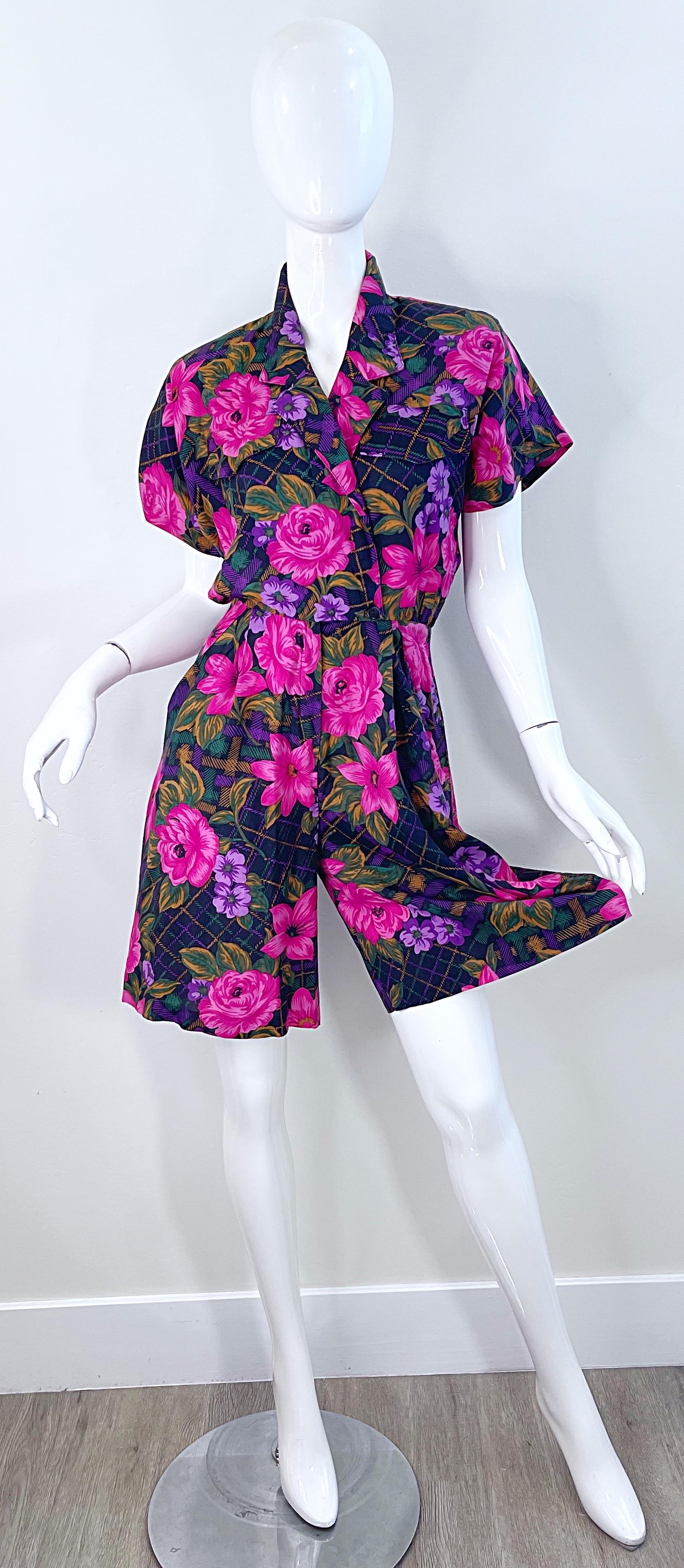 Pretty mid-late 80s flower and plaid print one pice romper ! Features soft rayon fabric in colors of pink, purple, green, navy and golden brown. Built in shoulder pads at each shoulder. Pockets at each side of the waist. Buttons at inner waist and