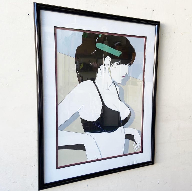 Exceptional framed and signed print Playboy Portfolio by Patrick Nagel. Sits in a black frame with canvas border.
 
