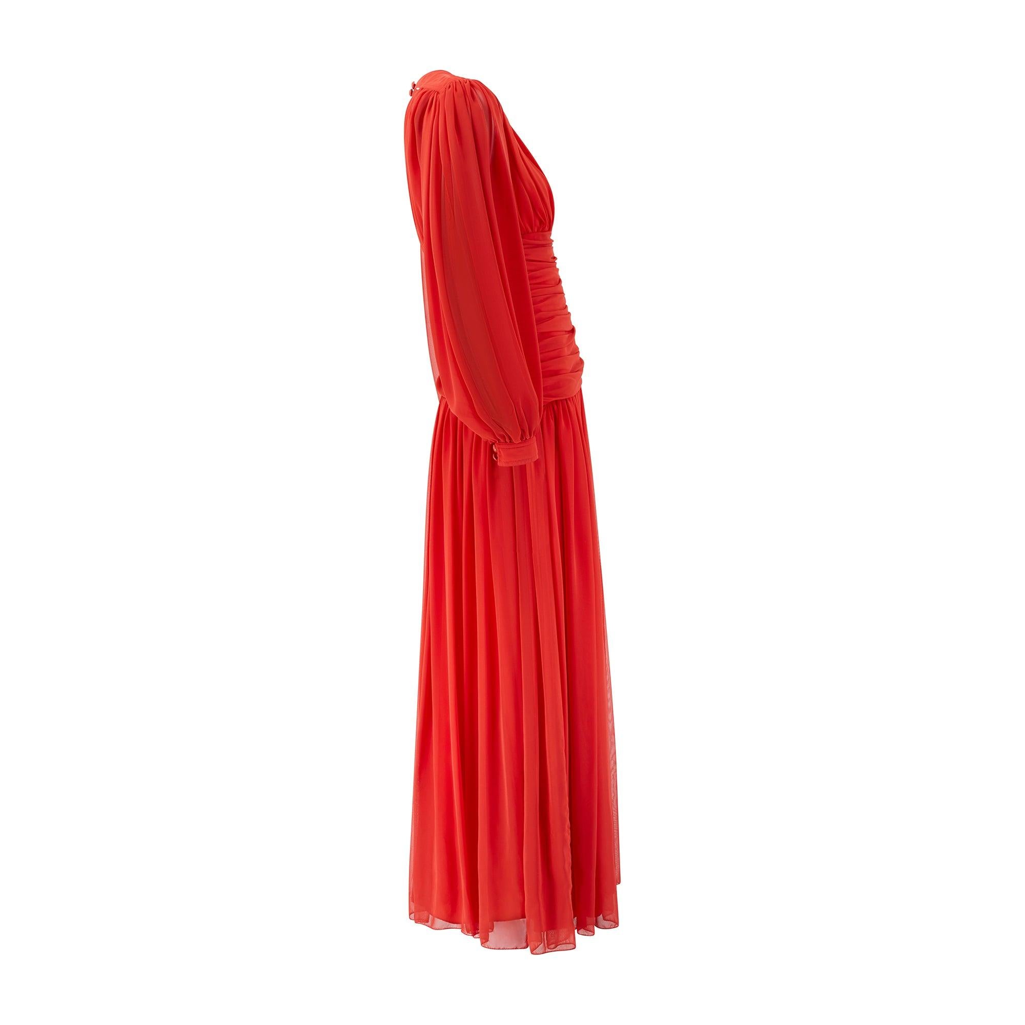 Founded in 1946 in London, Frank Usher's aim was to bring high-end details and fresh off the runway looks to shoppers at a more affordable price range, whilst not sacrificing quality or cut. This flamboyant dress is tailored from swathes of bright