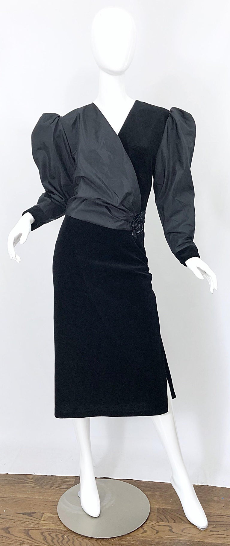 Avant Garde FRANK USHER black taffeta and velvet Size 14 cocktail dress! Features a criss-cross bodice with black taffeta on one side, and black velvet on the other side. Chic puff sleeves add just the right amount of drama. Crystal button at top