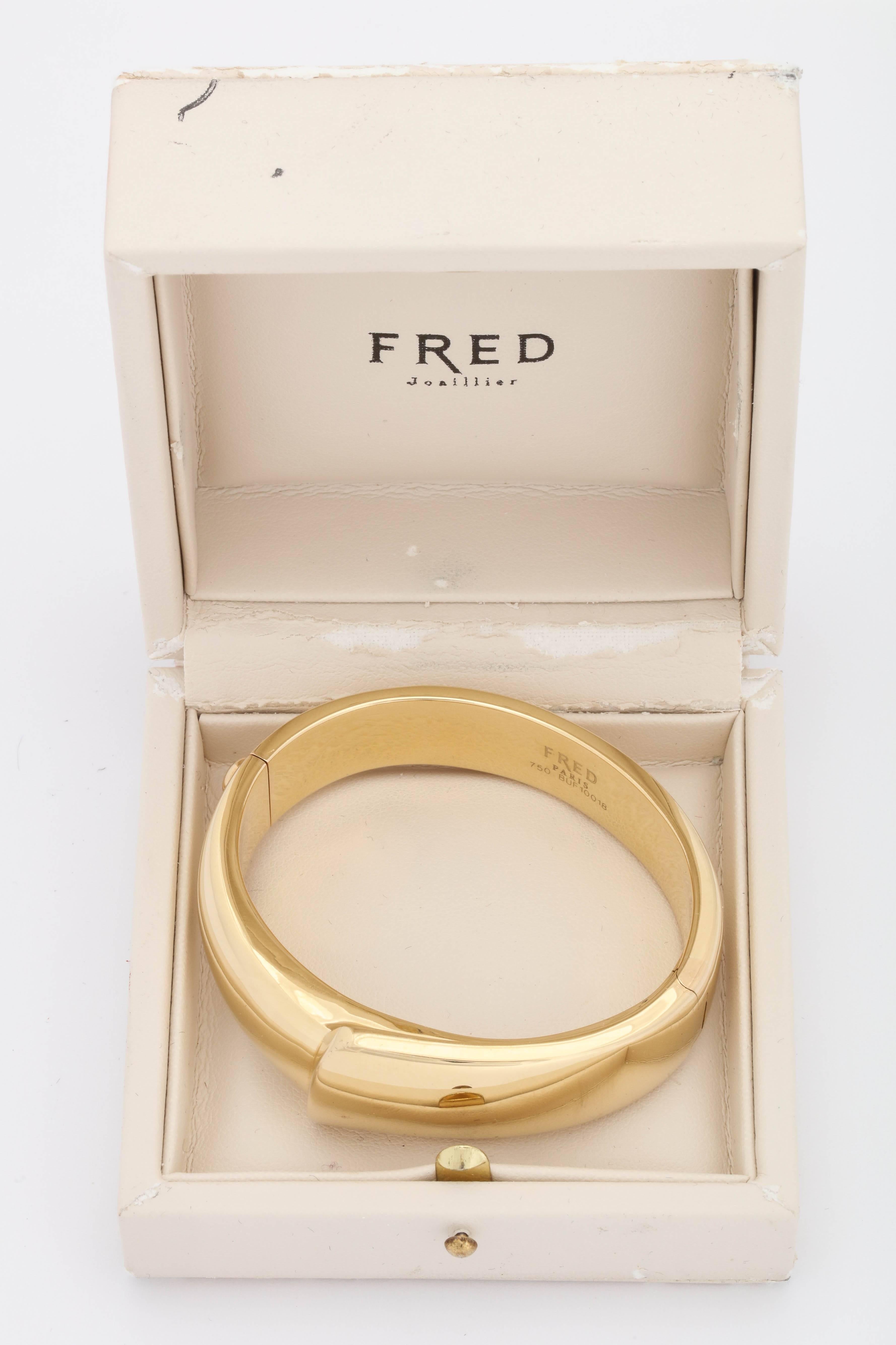 One Ladies 18kt High Polish Yellow Gold Hinged Bangle Bracelet Designed In An Asymmetrical Folded Handkerchief Motif. Designed By Fred Paris In The 1980's In France.Fits An Average Standard Size Wrist This Bracelet Is The Epitome Of Chic And Highly