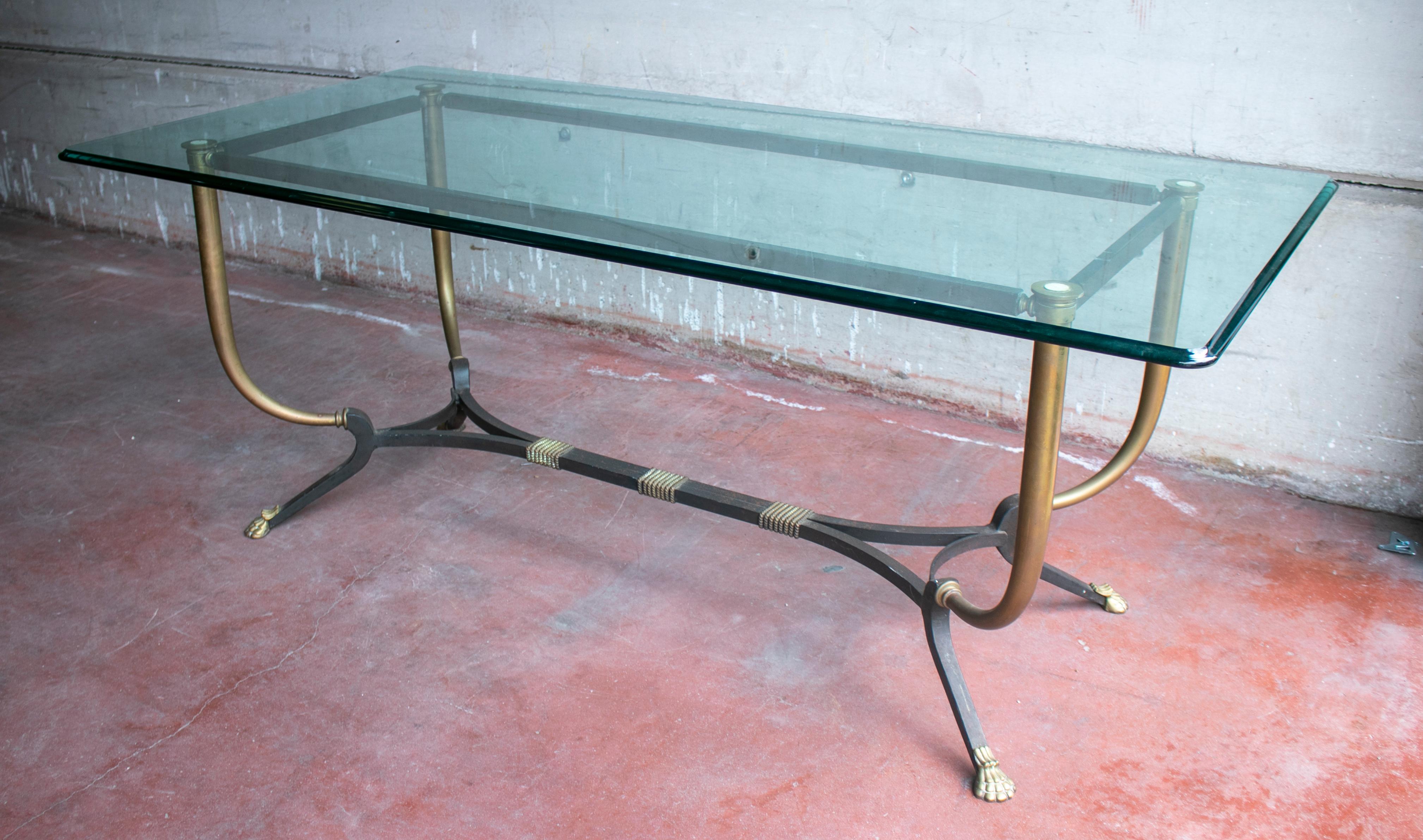 1980s French bronze and iron rectangular dining table with iron claw feet.