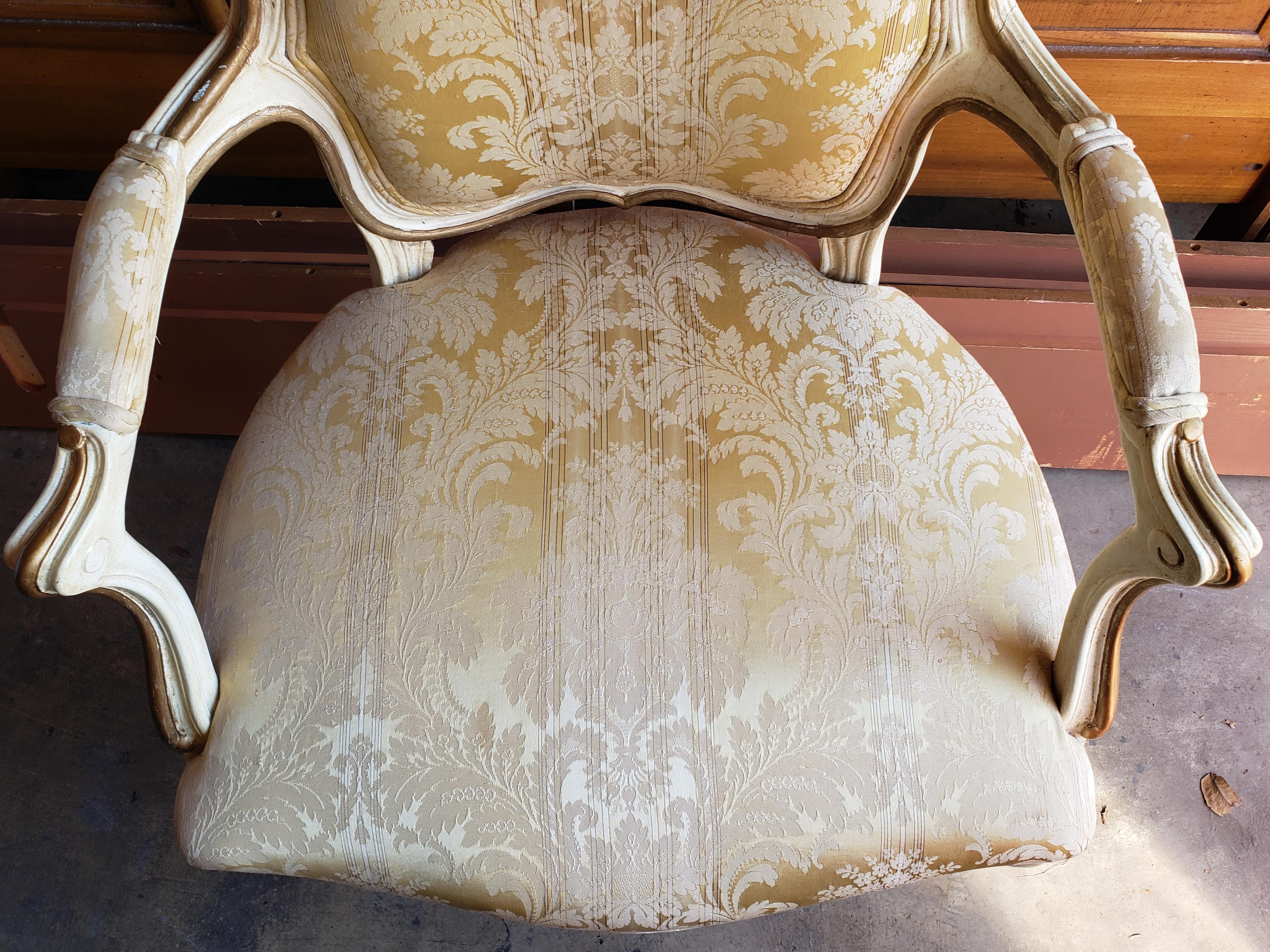 For your consideration is this fine French Louis XVI arm chair. Hand carved and meticulously painted and upholstered with a great quality fabric. Very good condition. Seat very firm and upholstery is clean and in very good condition. Meadures 24