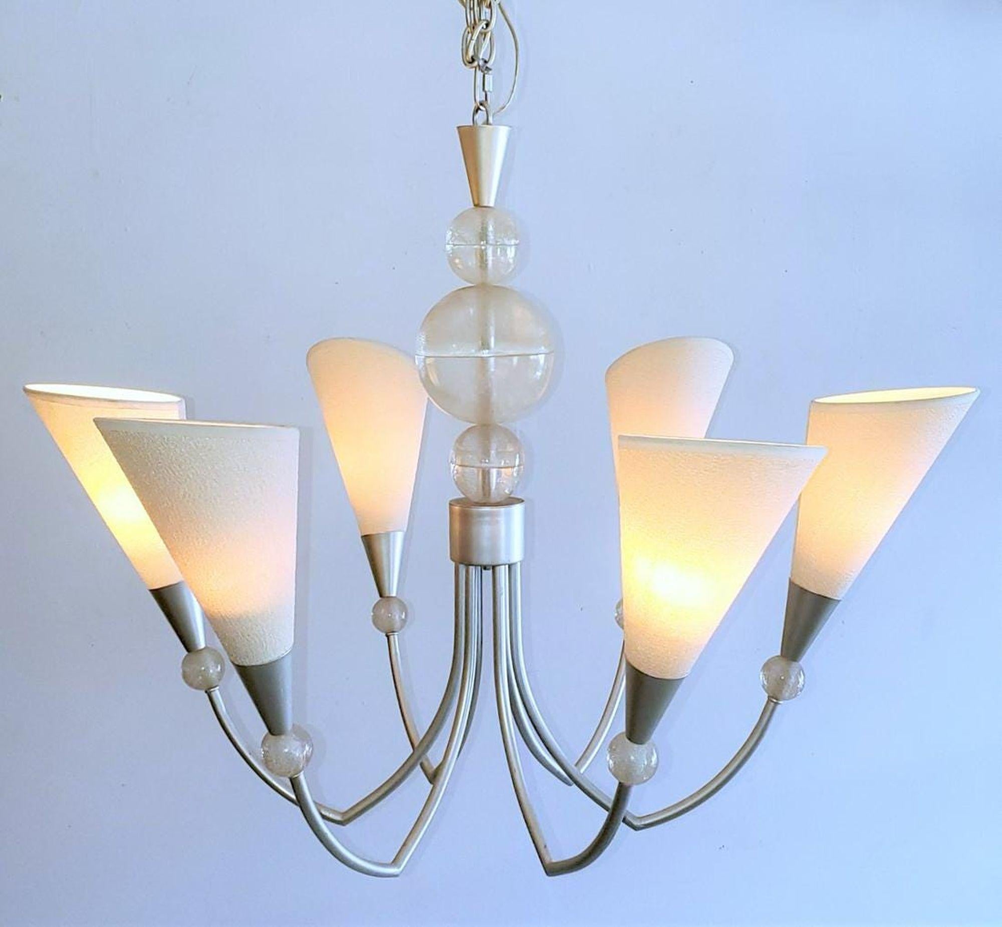 80s French Lucite Six Arm Chandelier with three Lucite center balls on the spine of the chandelier.
Six arms extending outward like flower petals with Lucite balls at the base of the shades opening the petal for illumination.

Beautiful chrome,