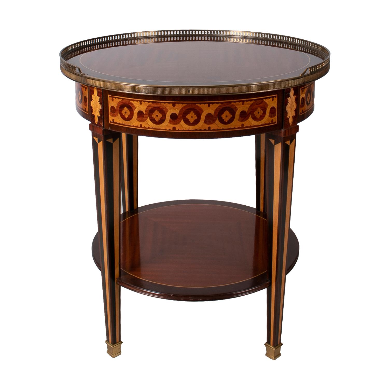 1980s French mahogany round side table with bronze decorations and inlays.