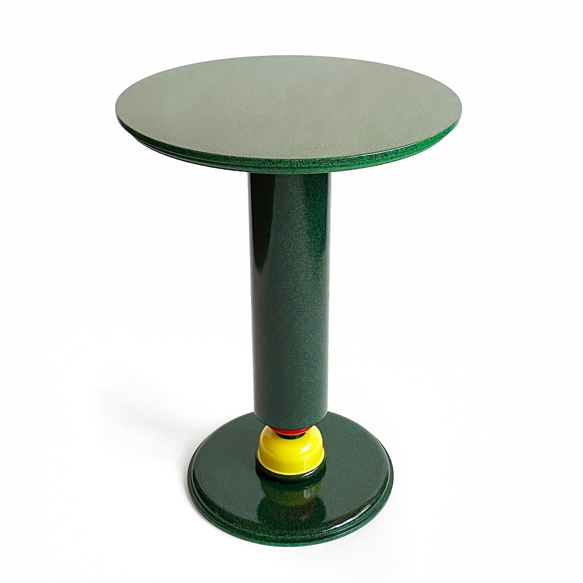 An exceptional 1980s French postmodern drinks or side table designed by Olivier Villatte.  Drawing on a strong Memphis Milano inspiration, Villatte created a high gloss lacquered wood table with a speckled green and black primary color scheme and