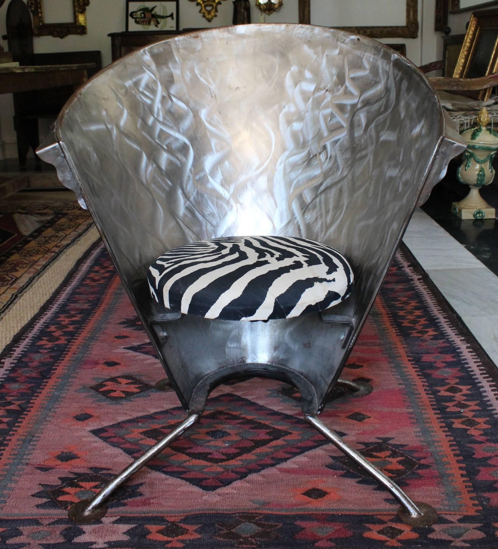 1980s Original French polished steel sofa chair with S-shaped patterns and zebra upholstery decorations.

