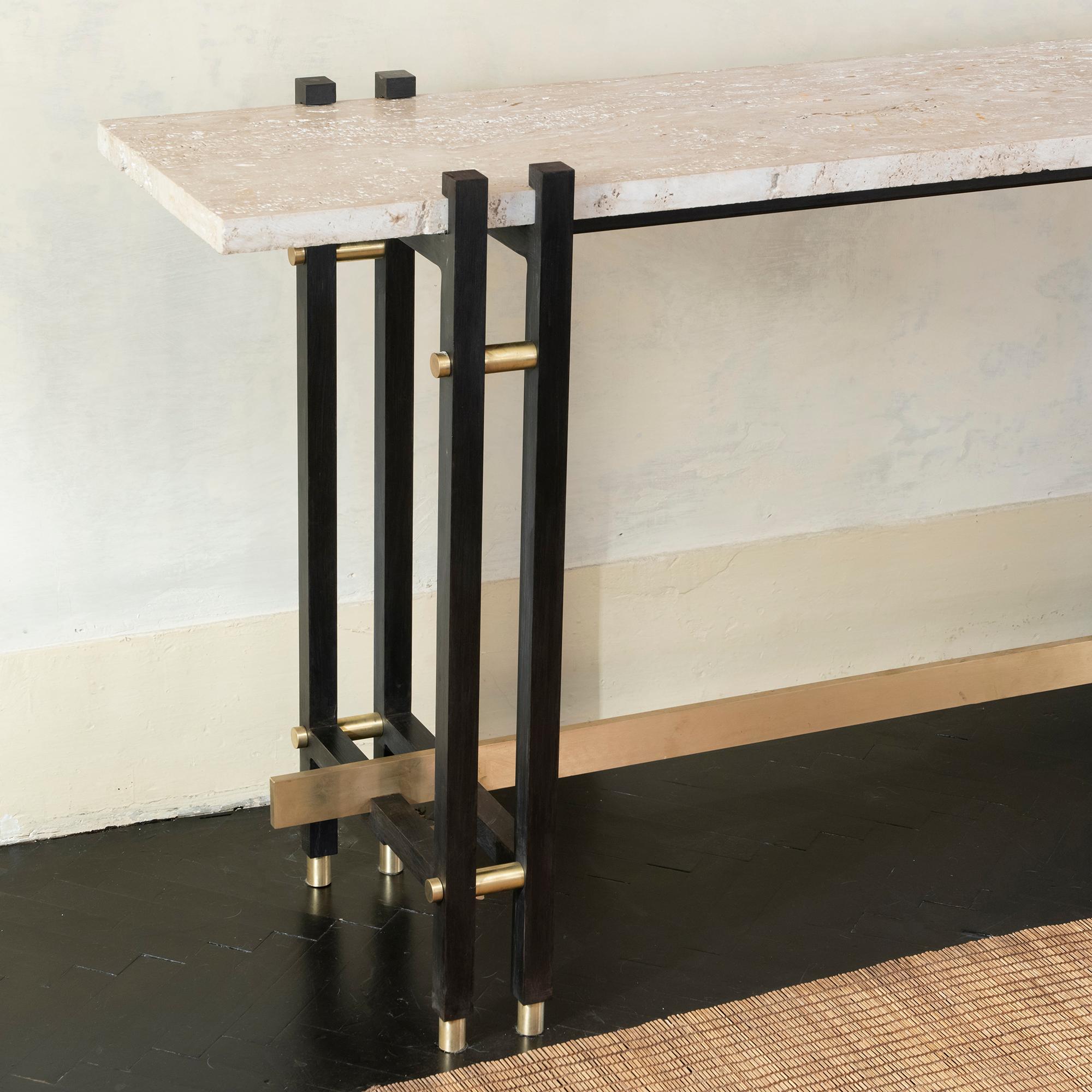 French console realized with a travertine slate attached to a raw steel sheet, the natural travertine top has peculiar characteristics such as holes and cuts that give the piece a strong and raw look but at the same time warmth thanks to its color,