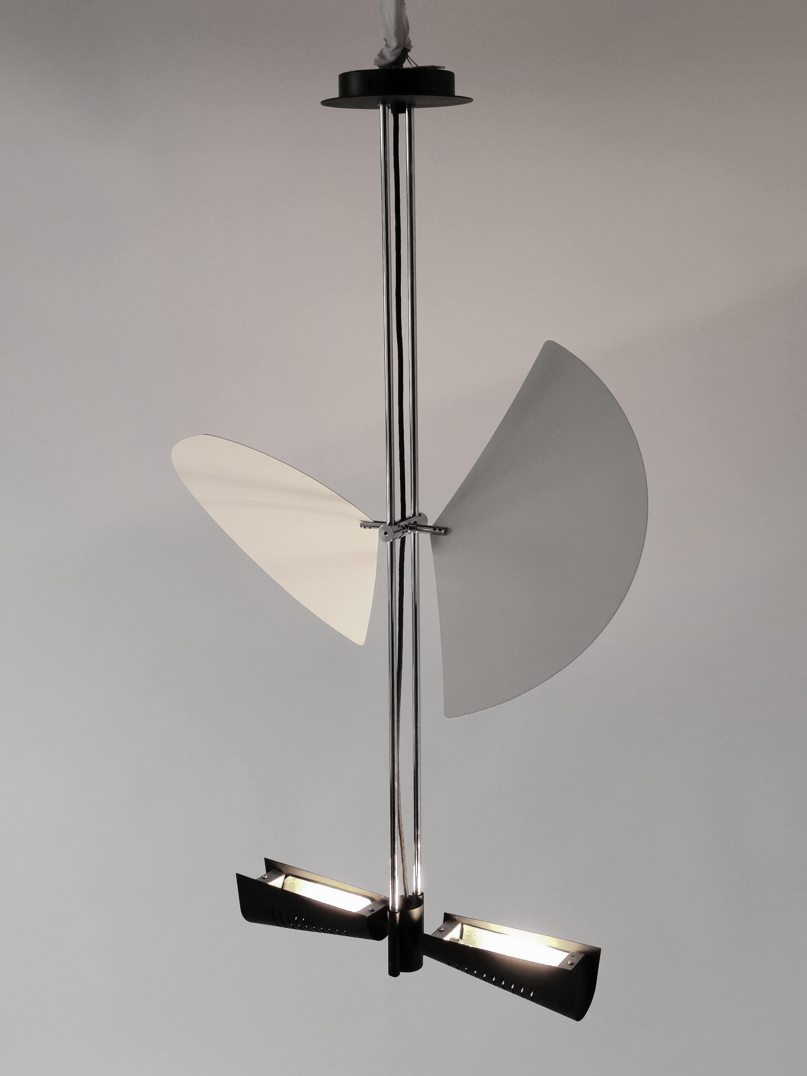 Graceful adjustable wing chandelier by Jorge Garcia Garay.

Agile deflector that turn 360 degree to direct light bounce. Slide up and down at any height on twin pole. 

Solid well made construction with prime quality material. 

Rugged