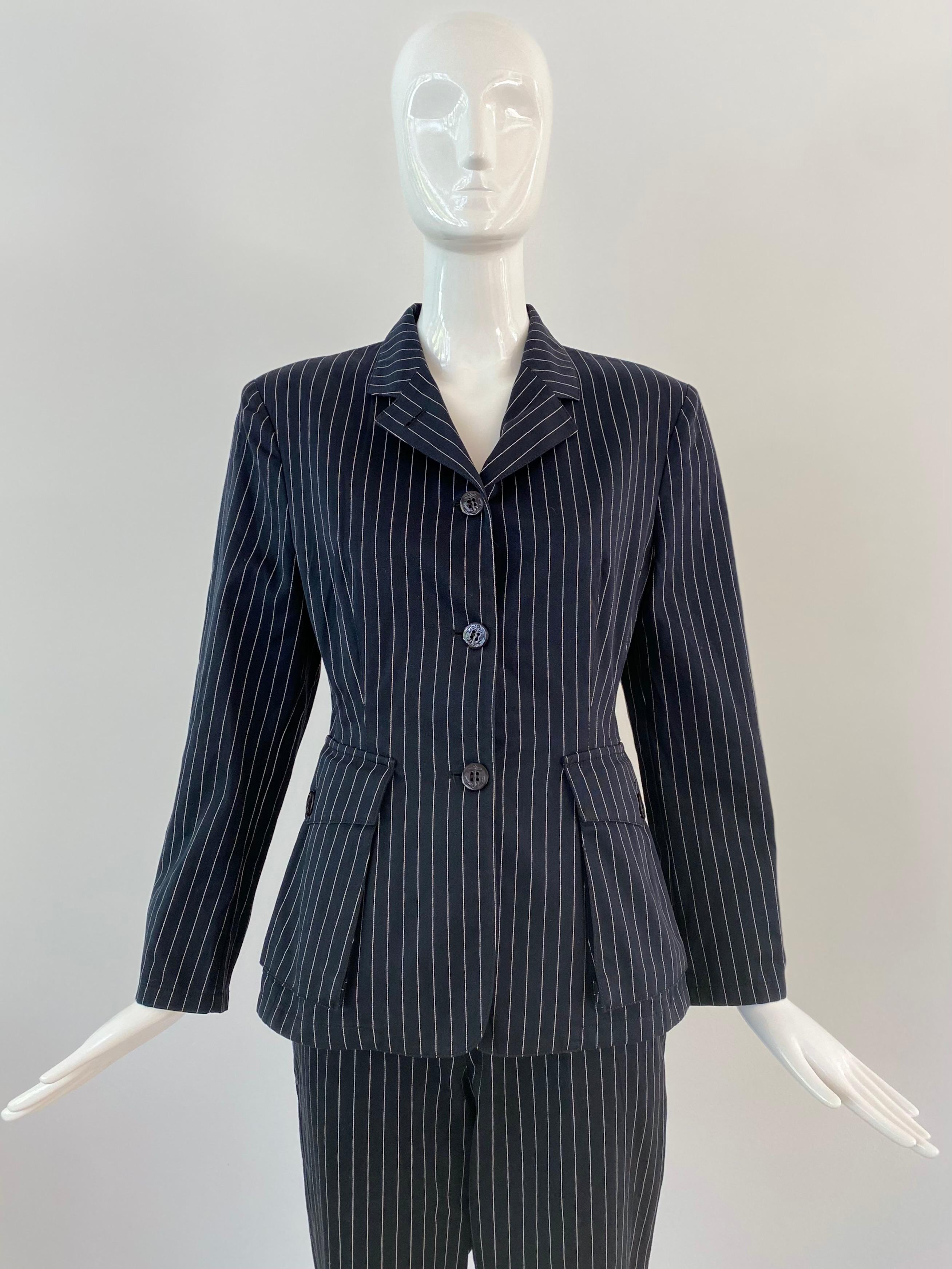 Incredible 1980 Gaultier Junior black and white striped cotton suit. The black buttons have the signature Gaultier anchor. All pockets are functional. Both pant and jacket are marked as an Italian size 44 but are more like a current size small. 