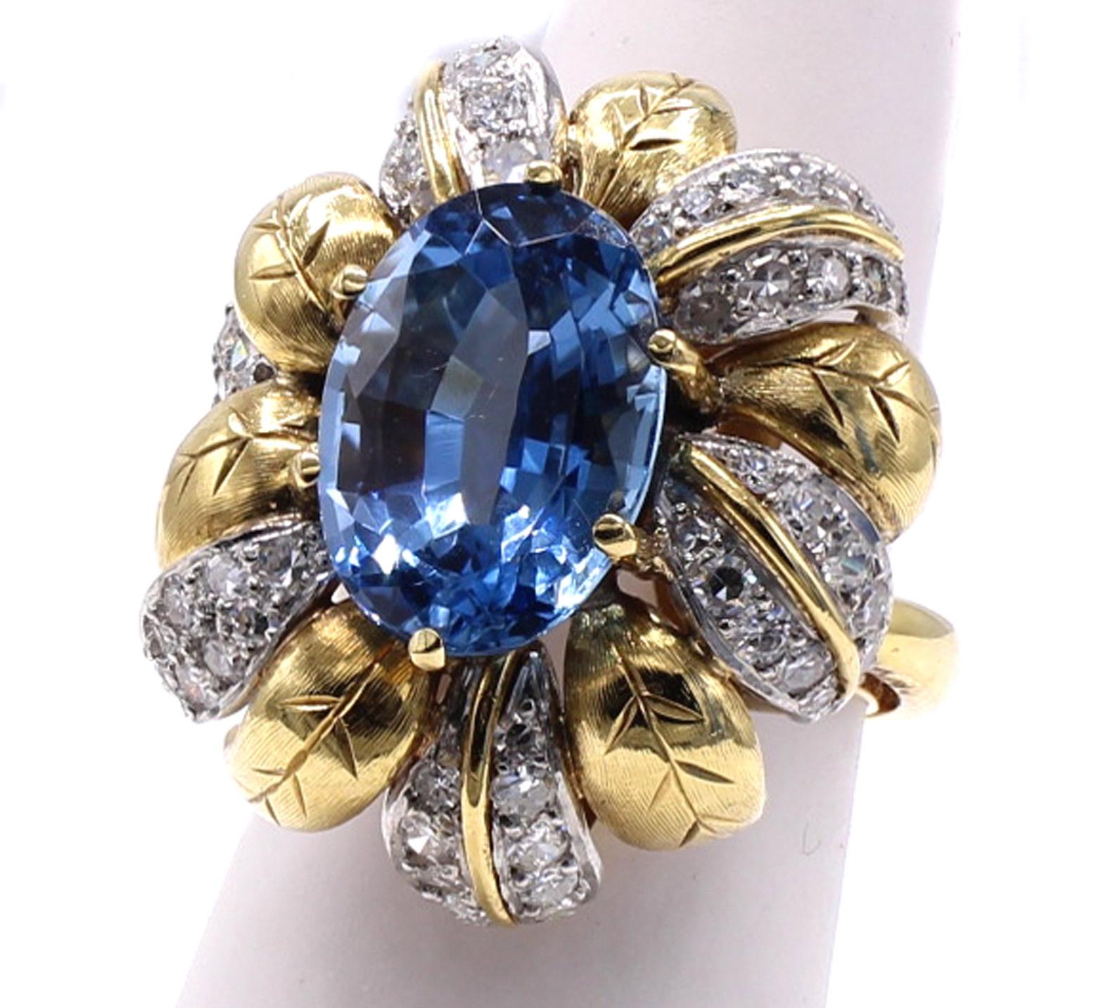 The centerpiece of this beautifully designed and masterfully handcrafted 1980s ring is a gem oval cut aquamarine weighing 5.11 carats. The intense blue of this aquamarine would have only been found in the famous Santa Maria mine in Brazil. The