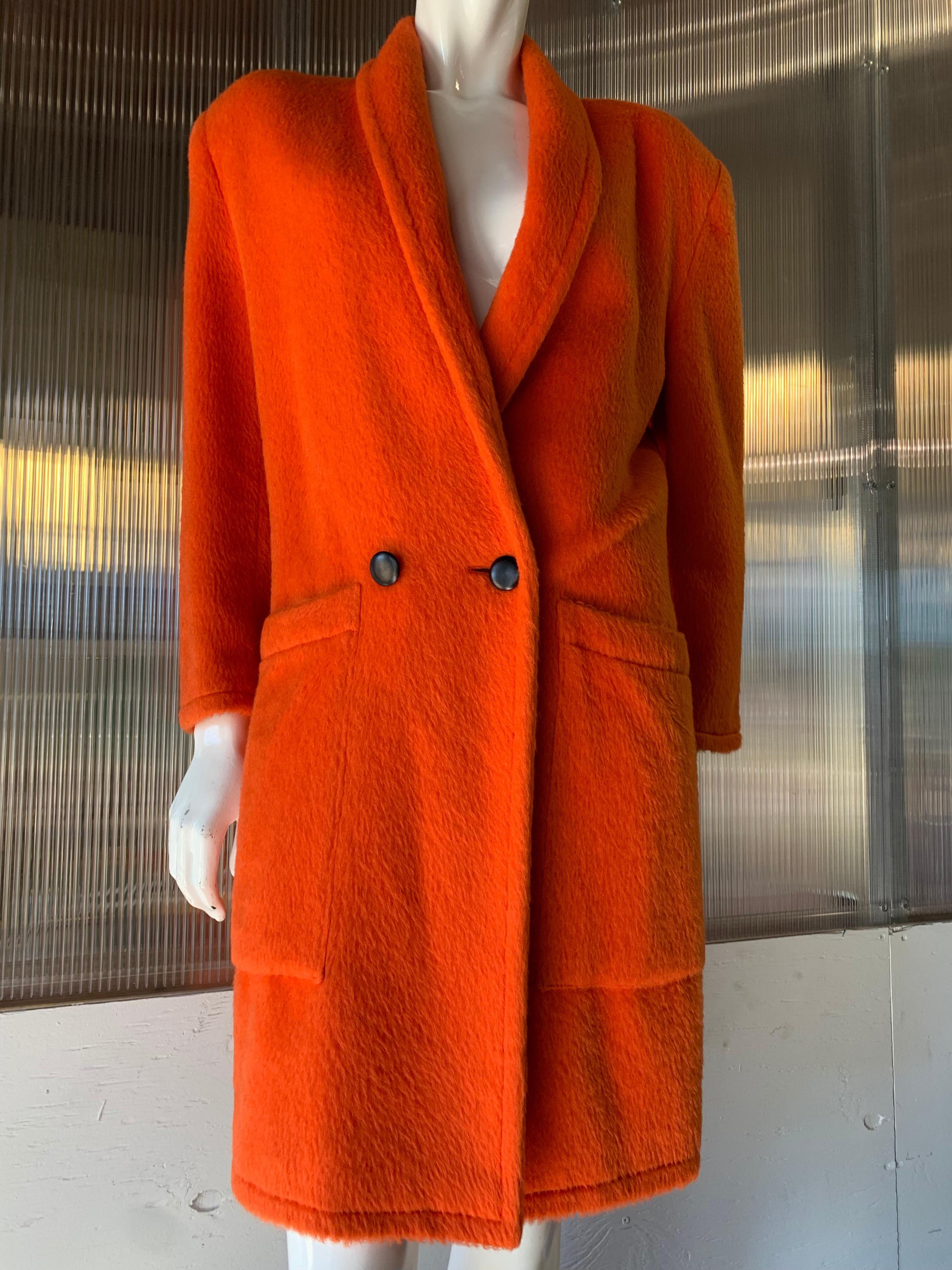 1980s Genny by Gianni Versace Vivid Orange Mohair Overcoat W/ Strong Shoulder Silhouette. Large front patch pockets. Narrow shawl collar. Low-slung double breasted buttons. Belted back.