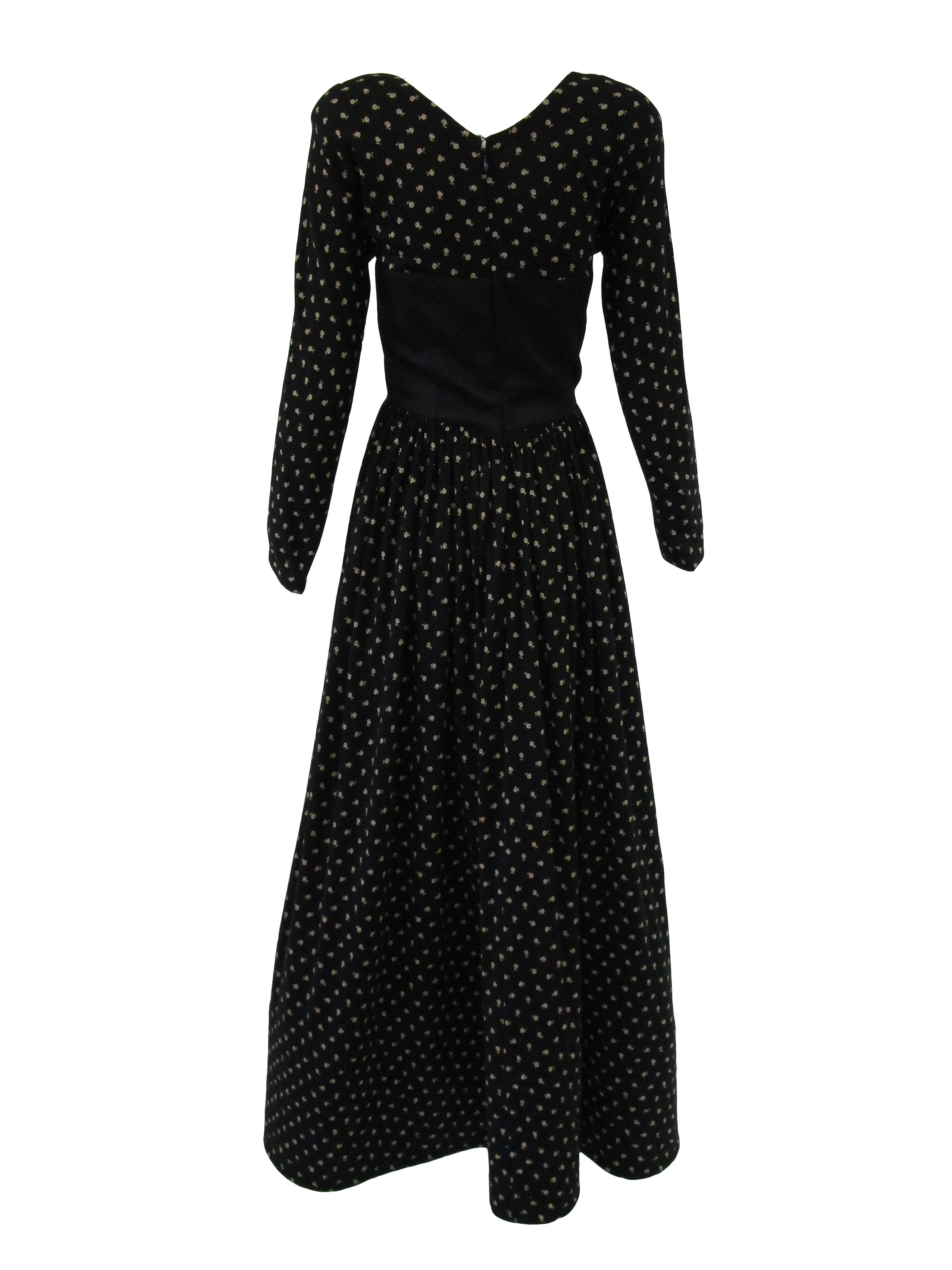 
Designer ensemble from Geoffrey Beene featuring a long wool knit printed dress with floral motifs & silk matelasse bodice. The beautifully quilted bolero has faux front pockets and star buttons and is lined in printed silk. The eight inch hem is