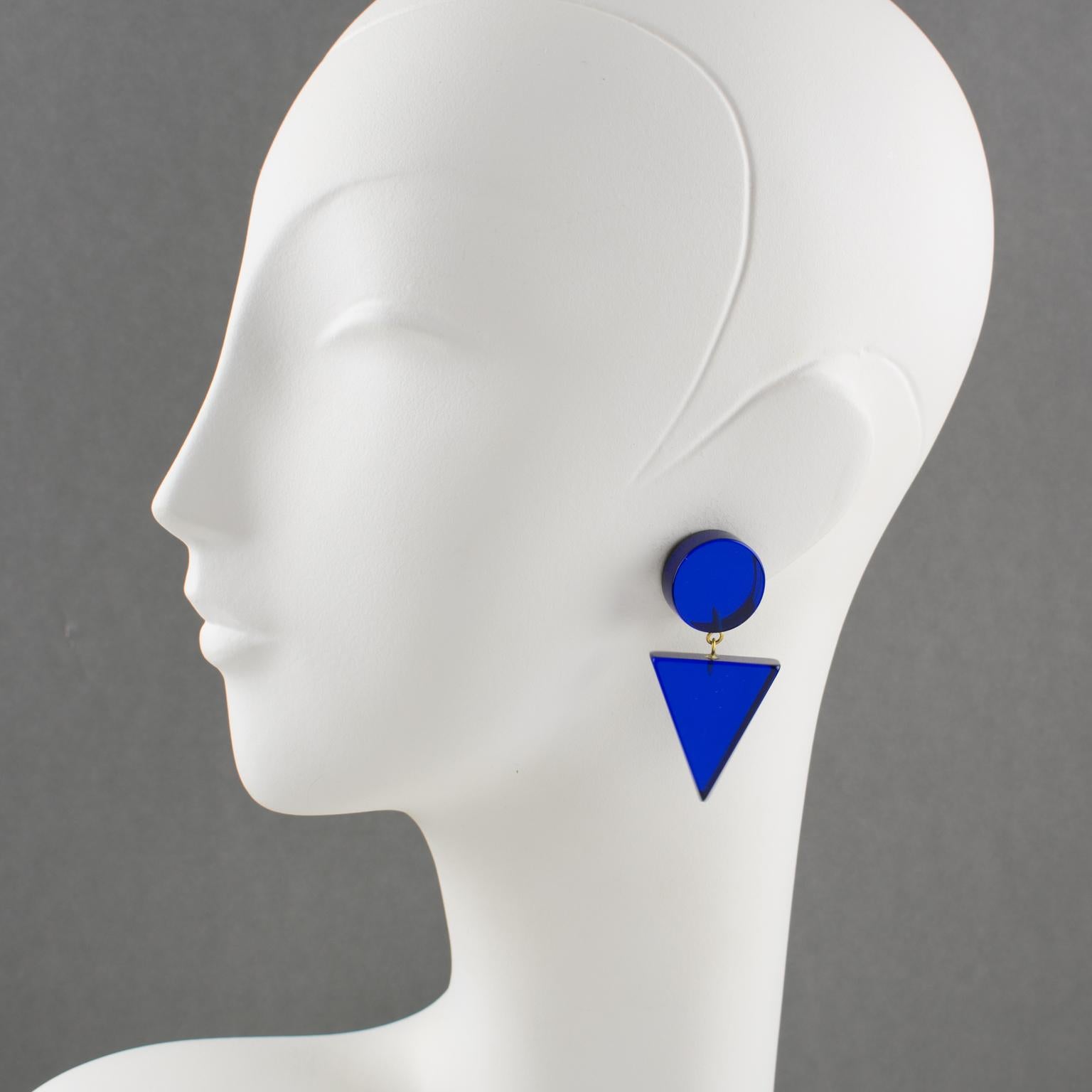 Lovely dangling Lucite clip-on earrings. Geometric chandelier shape with carving. Gorgeous intense royal blue color. No visible marking.
Measurements:  1 in. wide (2.5 cm) x 2.19 in. high (5.5 cm)