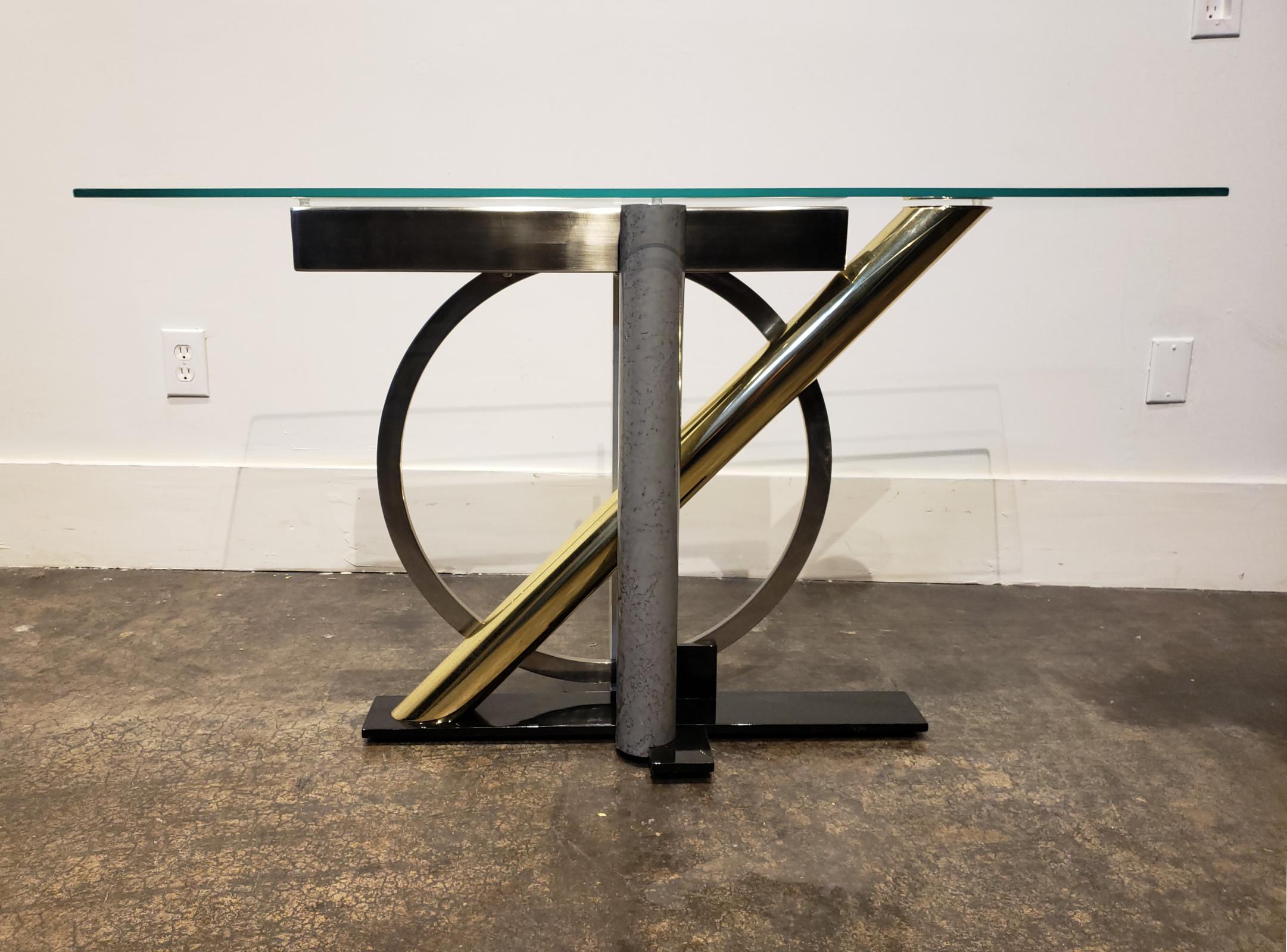 Kaizo Oto for the Design Institute of America enameled steel, chrome and brass Memphis Group-style console table. Beautifully composed mix of black, white and marbled-grey enameled steel and chrome and brass elements. Glass top is 1/2