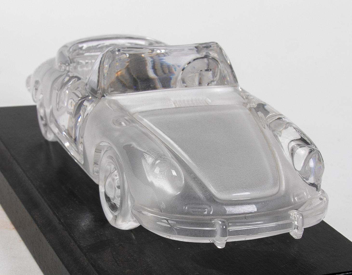 Sculpture of a porsche car made of glass by Magic Cristal.
 