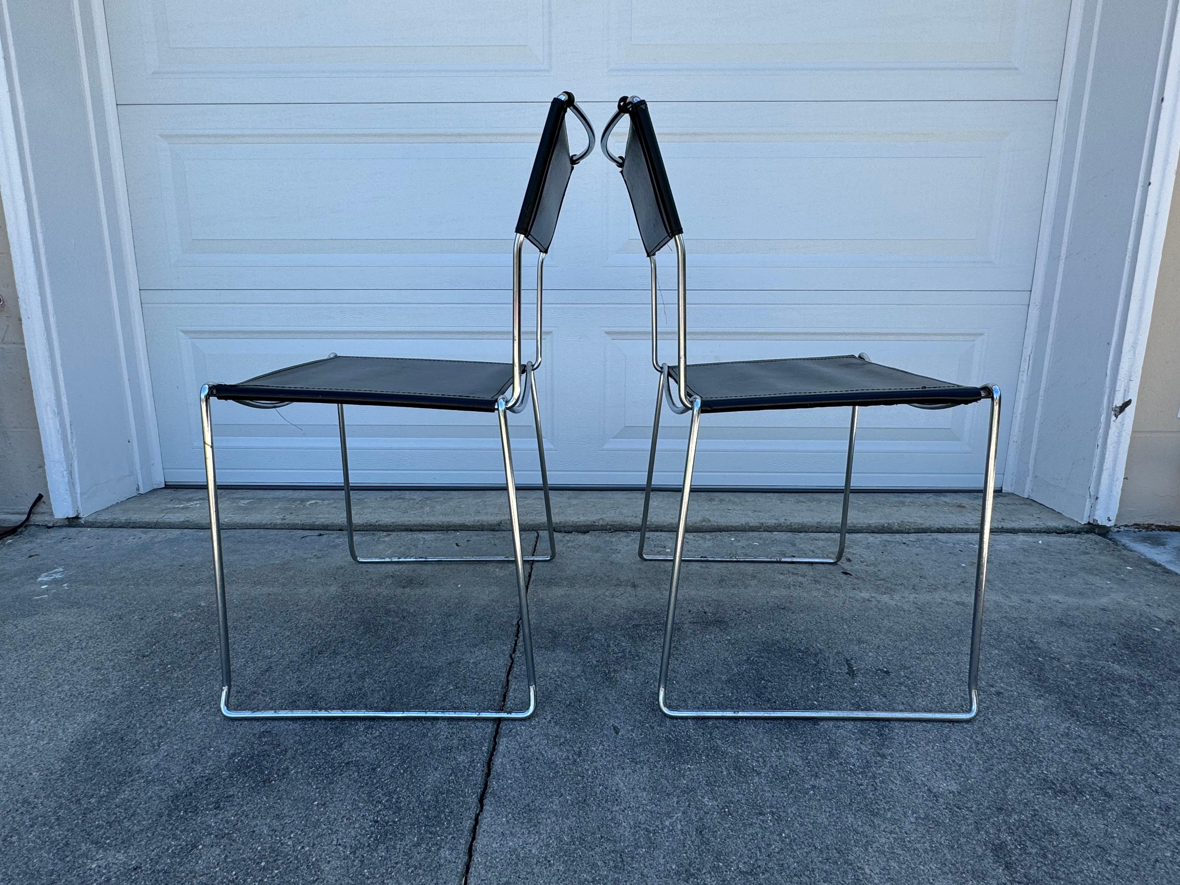 For Sale: Stunning Pair of Giandomenico Belotti Black Leather Dining Chairs

Elevate your space with these gorgeous, high-end designer dining chairs crafted by the renowned Italian master, Giandomenico Belotti. These chairs feature luxurious black