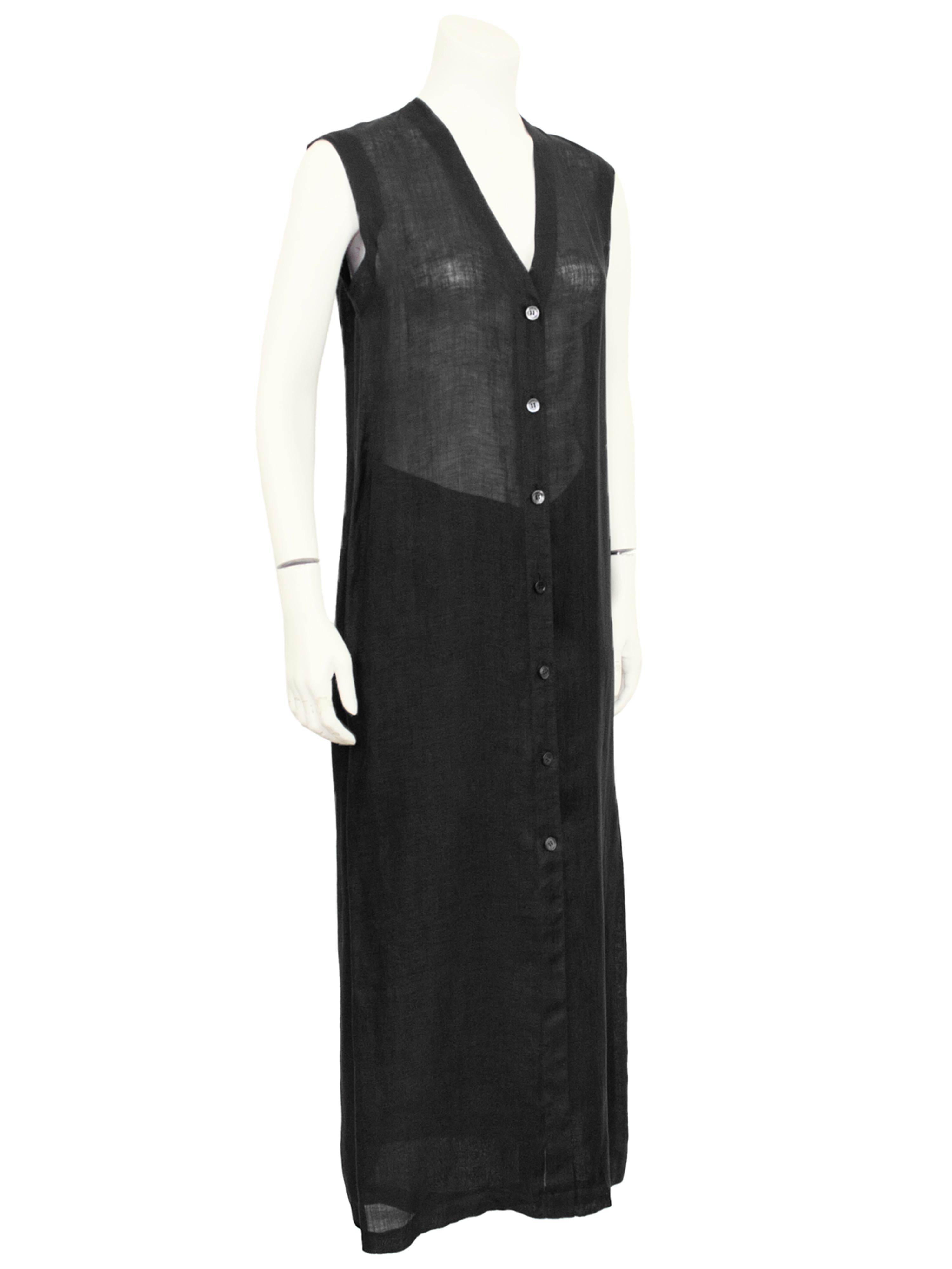 Light and breezy 1980s Gianfranco Ferre black linen ensemble featuring a long vest and skirt. Both pieces are extremely minimal. The vest is about ankle length with a slit at left side seam when wearing for freedom and movement when walking. The