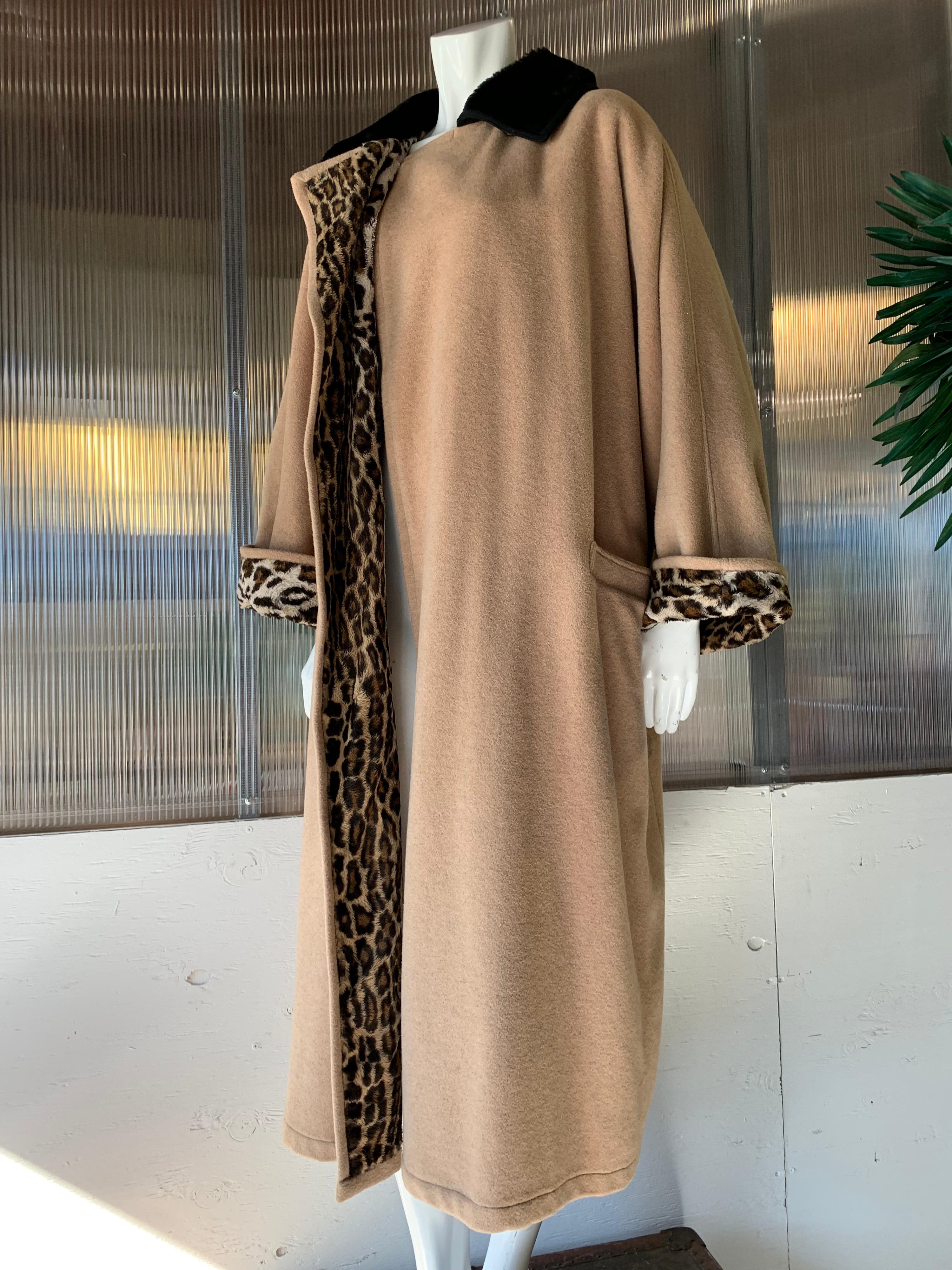 1980s Gianni Versace Camel Color Wool & Cashmere Overcoat W/ Faux Leopard Lining. Sculpted fur collar, brass buttons at collar.  Full, boxy, overcoat-style cut.