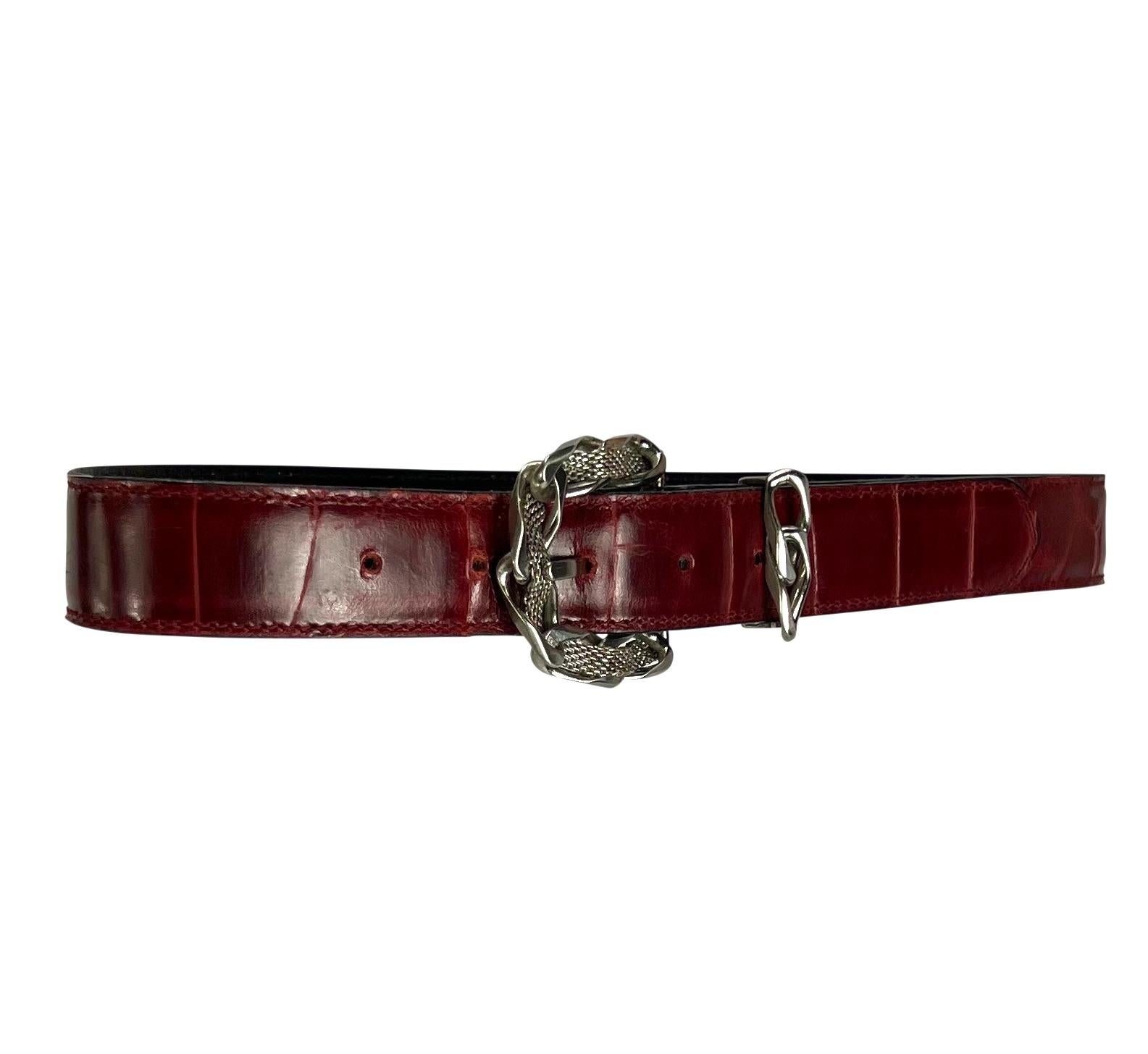 Presenting a fabulous red crocodile Gianni Versace belt designed by Gianni Versace. From the 1980s, this belt is complete with a chain belt buckle with metal mesh woven between the links. 

Approximate Measurements: 
Length: 25.5