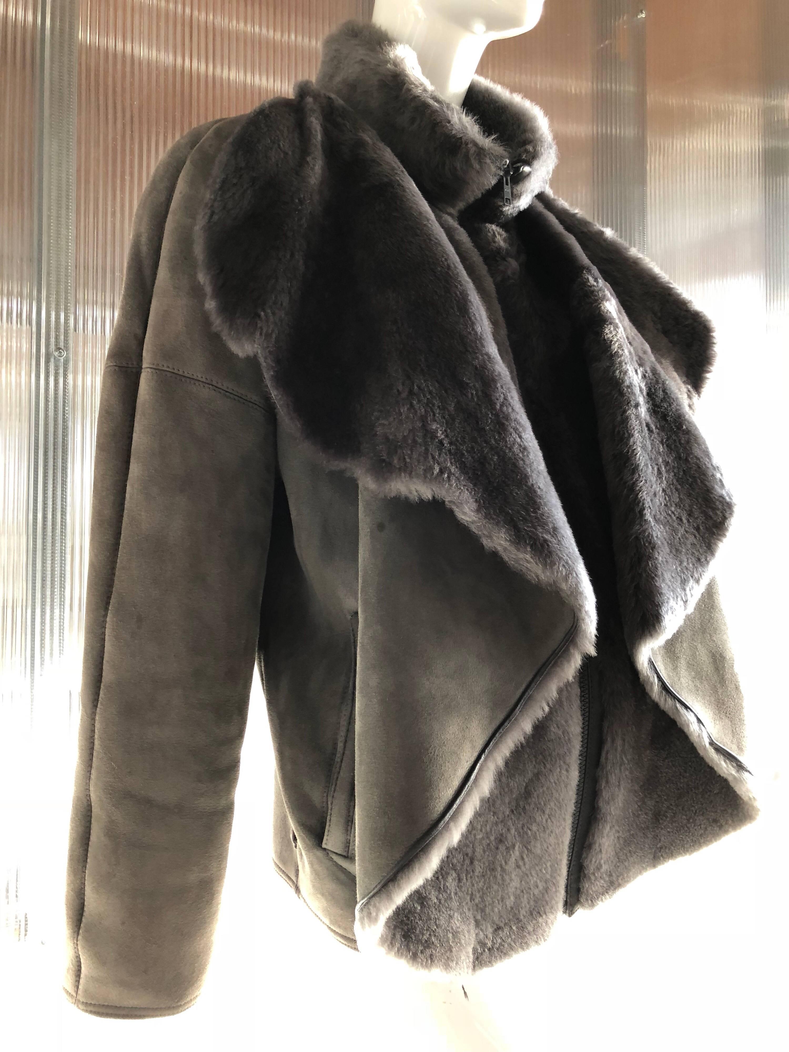 1980s Gianni Versace soft gray shearling jacket with zippered front and luxurious draped front. High zip-up banded neck. Fits at the hip. Size 42. 