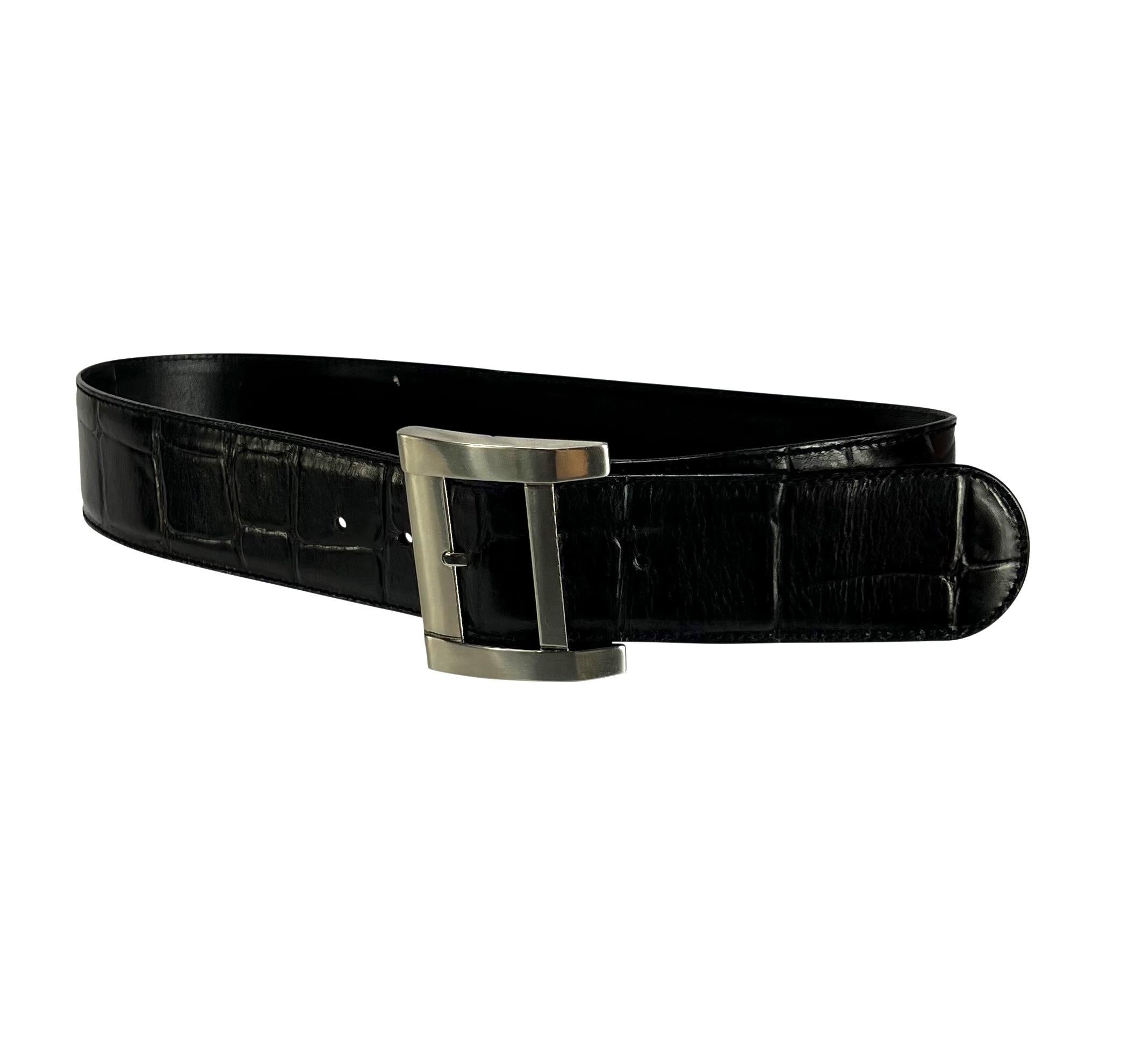 Presenting a fabulous black leather crocodile embossed Gianni Versace belt, designed by Gianni Versace. From the late 1980s, this wide belt is made complete with a large angular silver-tone buckle.

Approximate Measurements: 
Length: 35.75