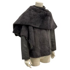 1980s Gianni Versace shearling leather cape jacket with layered construction sca 1980s Gianni Versace shearling leather cape jacket with layered construction sca