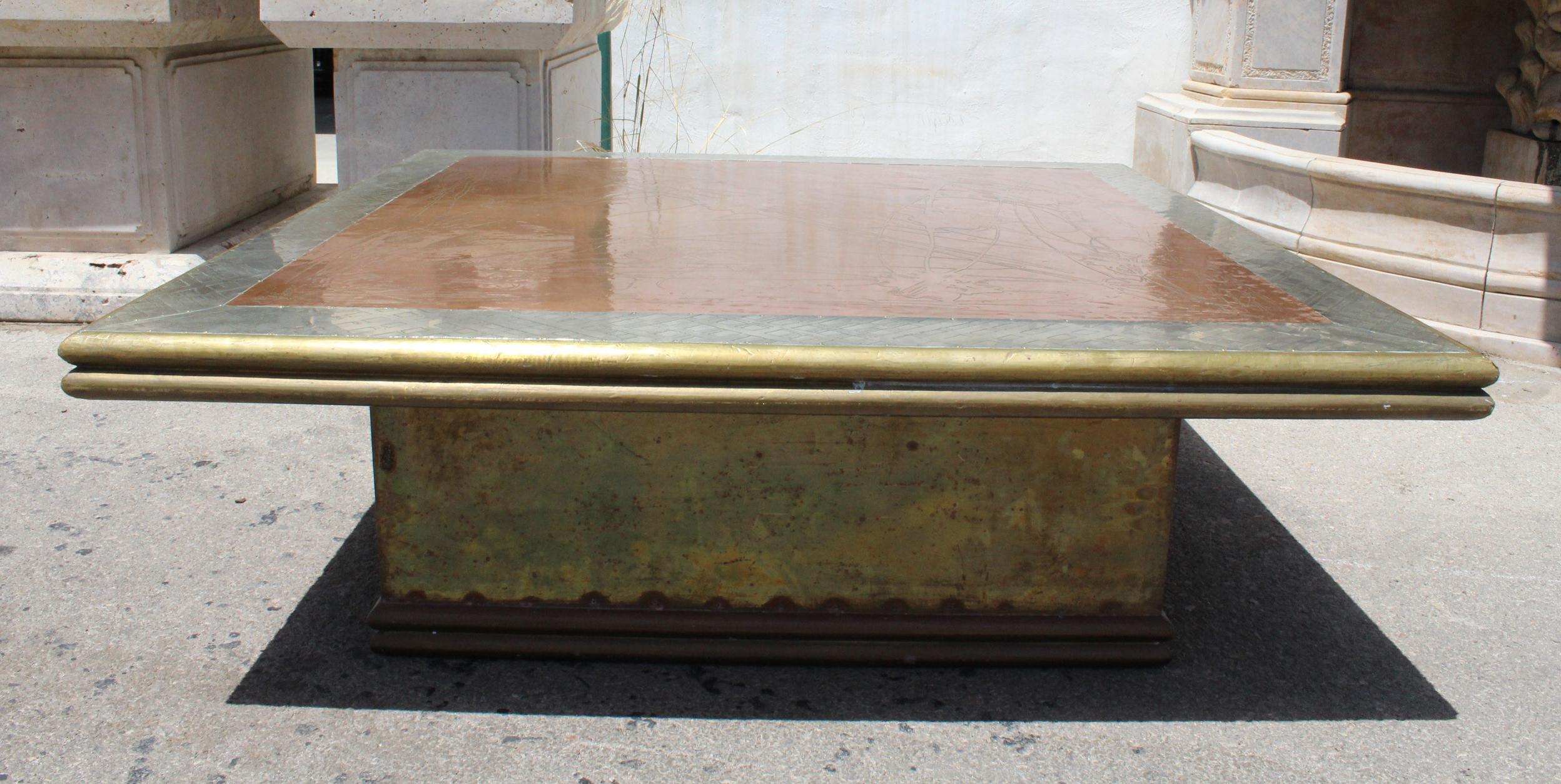 1980s gilded brass coffee table by Rodolfo Dubarry who set up his workshop in Marbella, where we are based. Gilded brass hand worked over a wooden frame. We have many examples of his work.