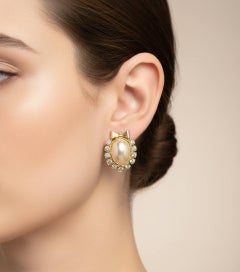 1980s Gilted Metal Rhinestones and faux Pearls Italian Ribbon Clip-on Earrings