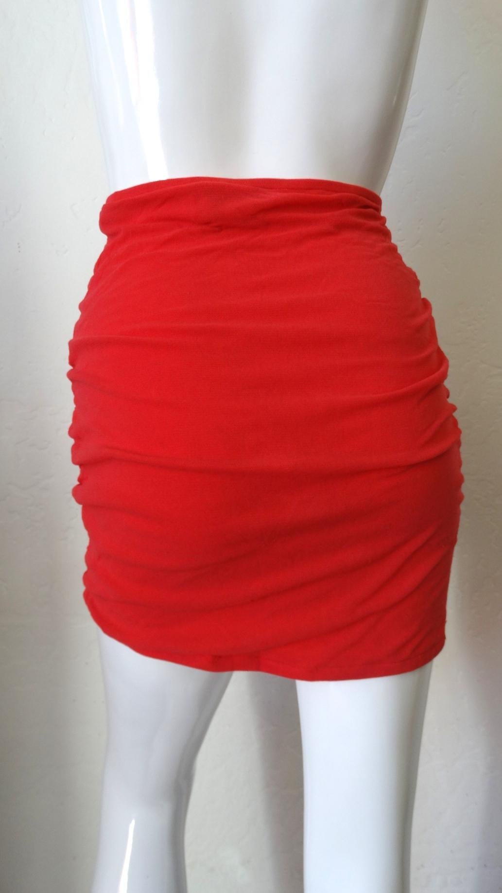 Make Your Beach And Pool Look A Whole Outfit! Circa 1980s, this Giorgio di Sant Angelo skirt coverup is made of vibrant red mesh and has a lined interior. Features ruching on the sides to create natural soft pleating in the front and back. Matching