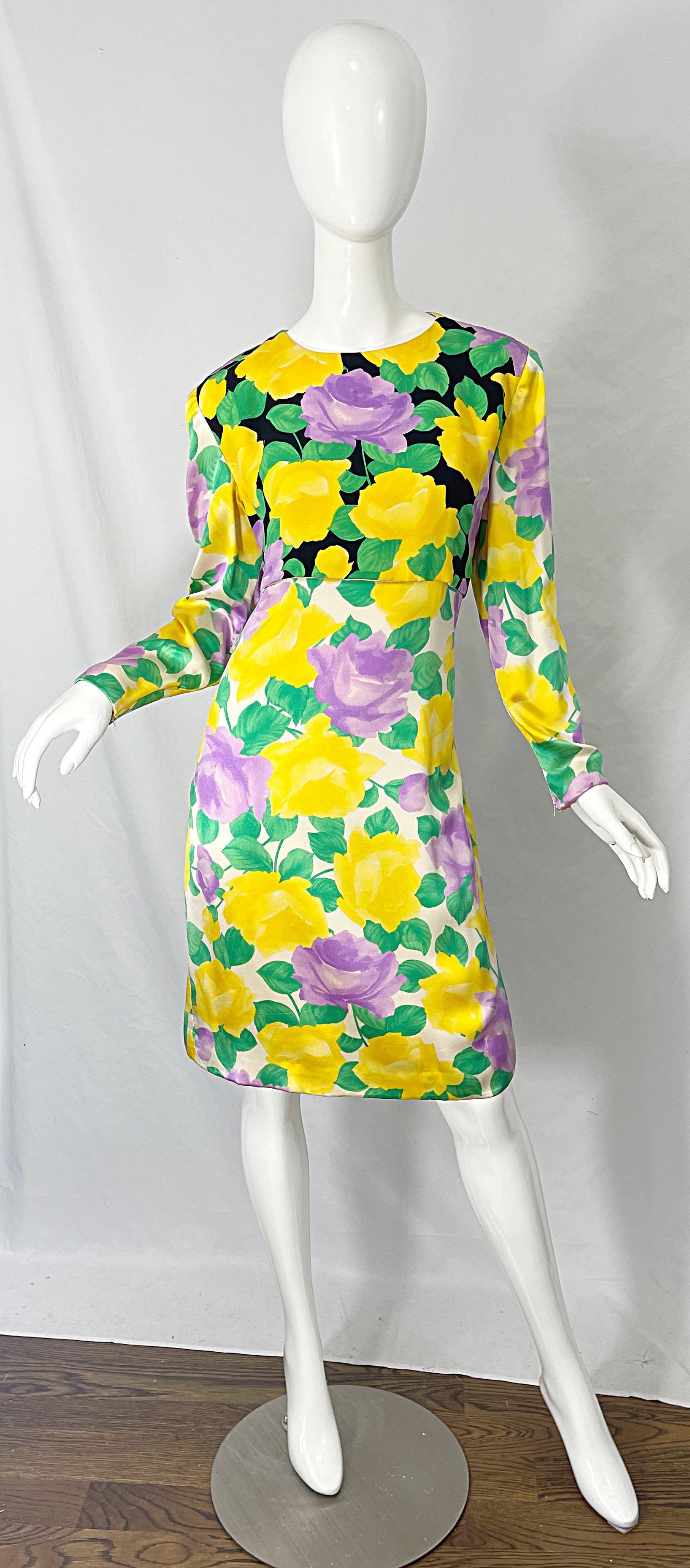 Beautiful vintage 80s GALANOS silk dress! Features roses / flowers in vibrant colors of yellow, purple, green, black and white. Hidden zipper up the back with hook-and-eye closure. Tailored bodice with hidden zippers at each sleeve cuff. Very well