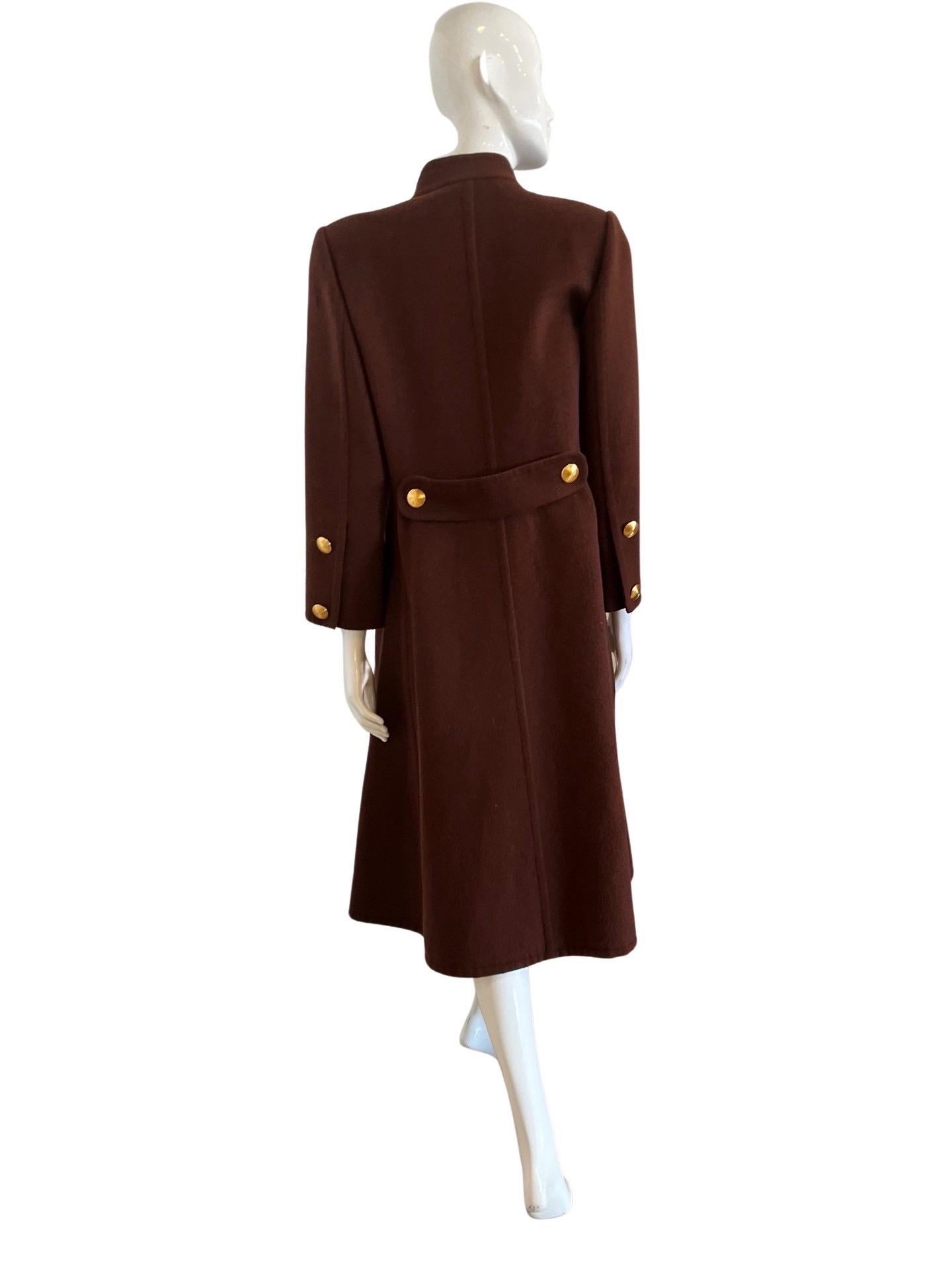 Givenchy Couture from the 1980s, the composition label is not clear, but it would feel to be cashmere or a cashmere wool mix. This coat is incredible and the colors are very unique. A warm chocolate brown on the outside and peach colored inside,