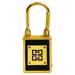  Porte-clés Givenchy en métal doré avec logo des années 1980