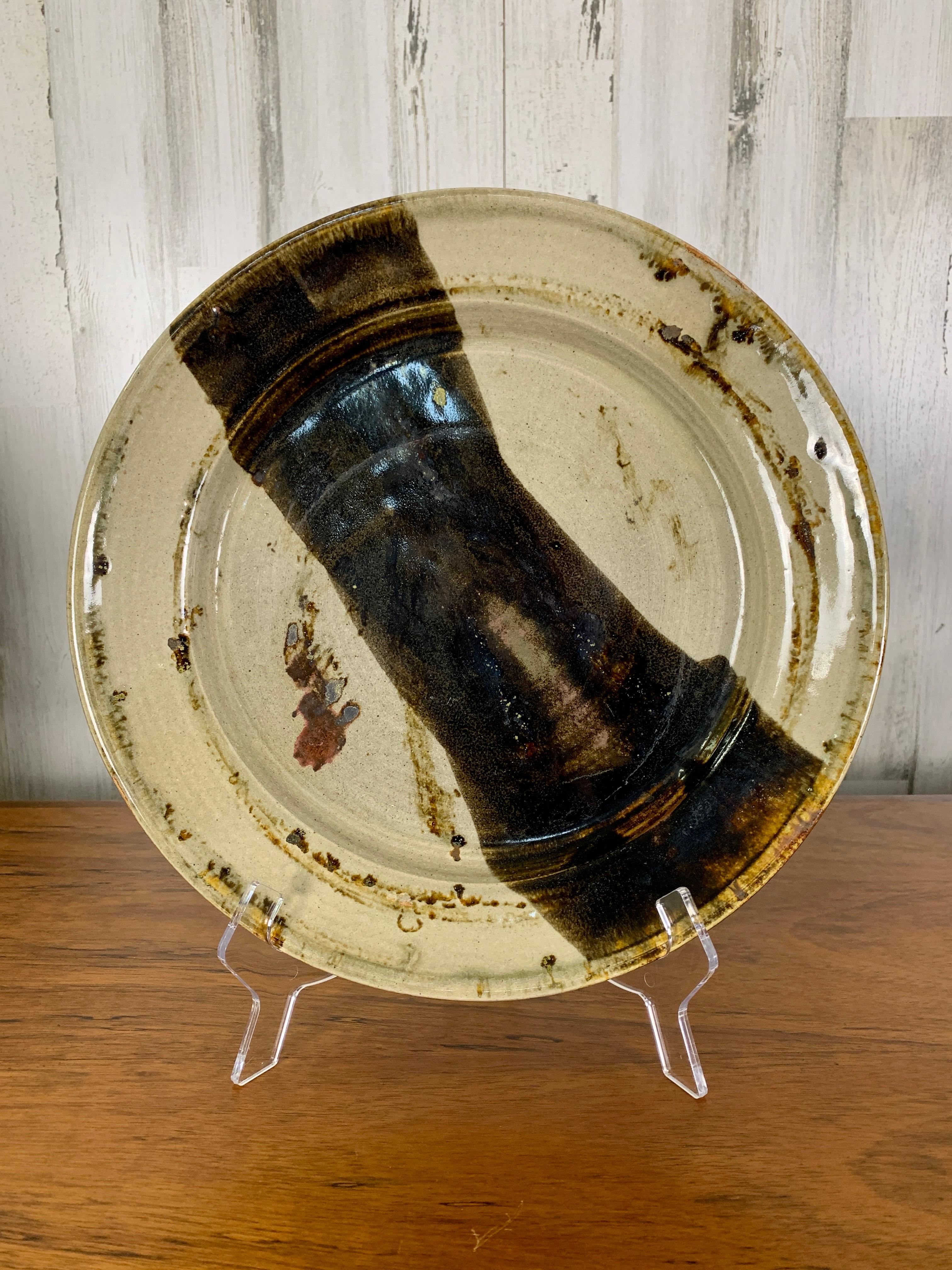 Studio crafted large plate / charger with abstract glaze.