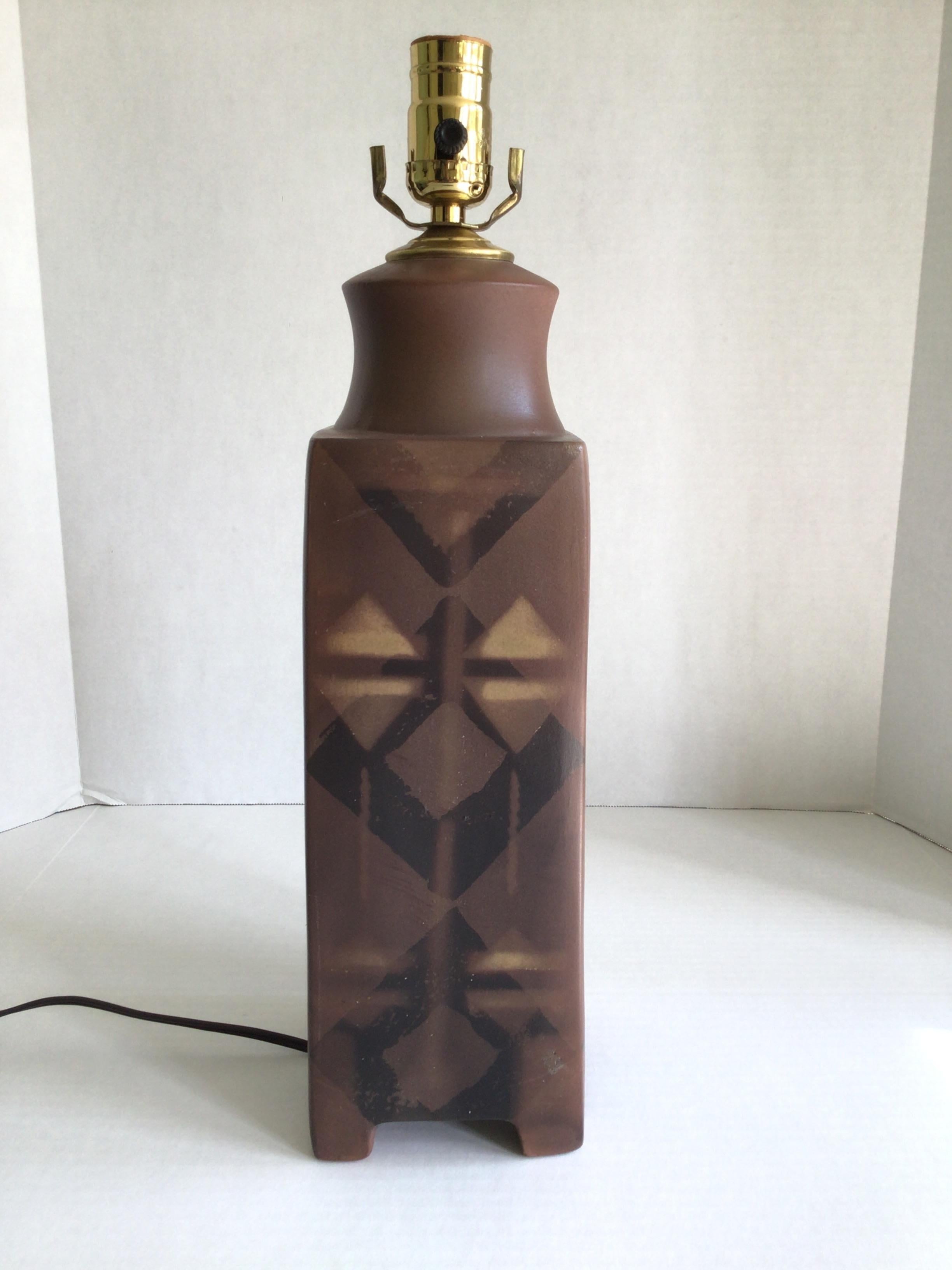 1980s Glazed Ceramic Table Lamp
Signed on Bottom: D Dickson (as shown)
Taupe Brown, Black, and Cream
Geometric, kaleidoscope, dimensional patterning

Needs Rewiring