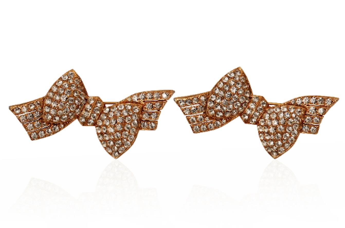 1980s superb quality pave set diamantes in a stylish bow design and even better – you get to have both!  They appear to be gold plated with an etched reverse and C-clasp to fasten.  Not signed but purchased in a collection which contained only the