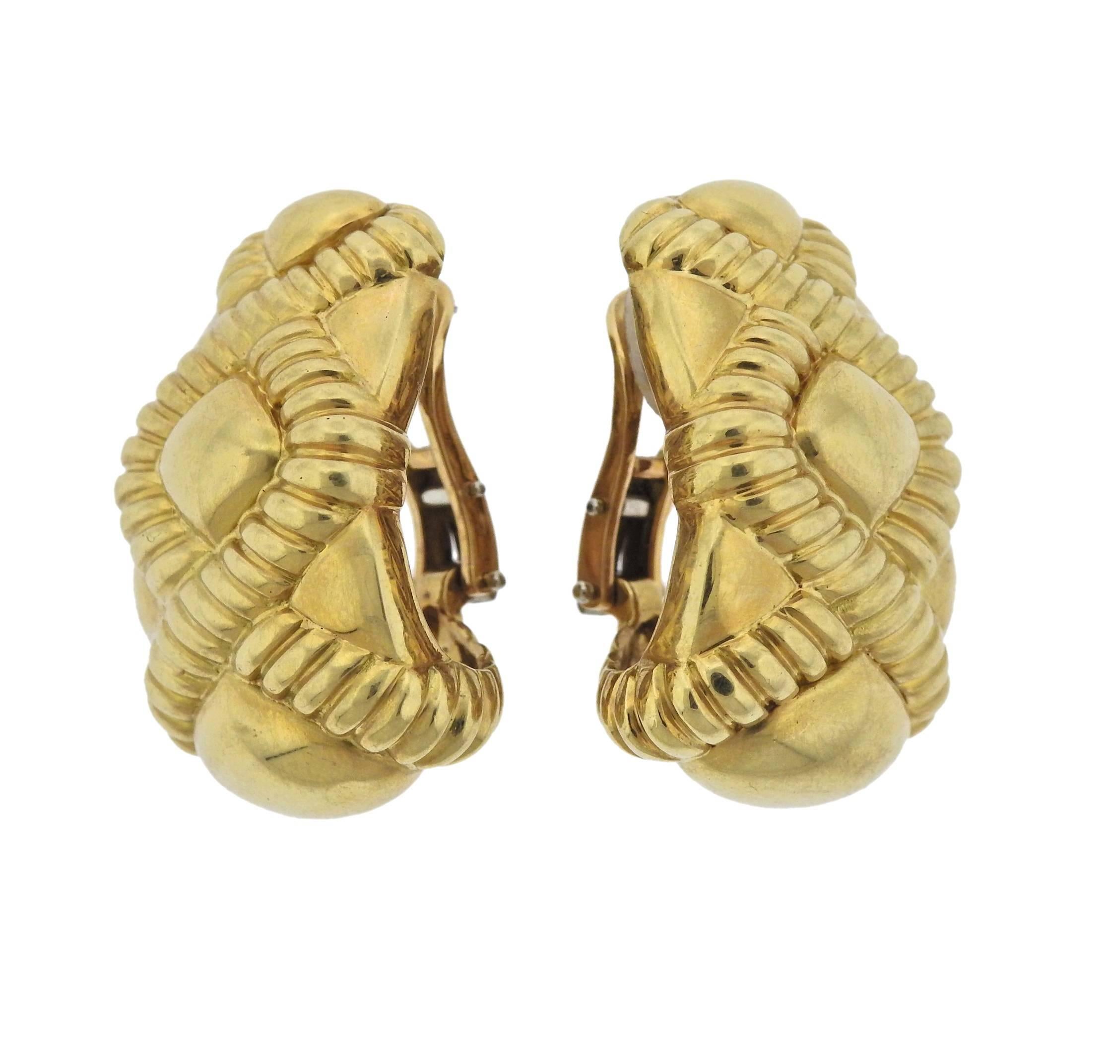  Pair of large half hoop 18k gold earrings. Earrings are 34mm x 22mm, weigh 38.9 grams. Marked 18Kt.