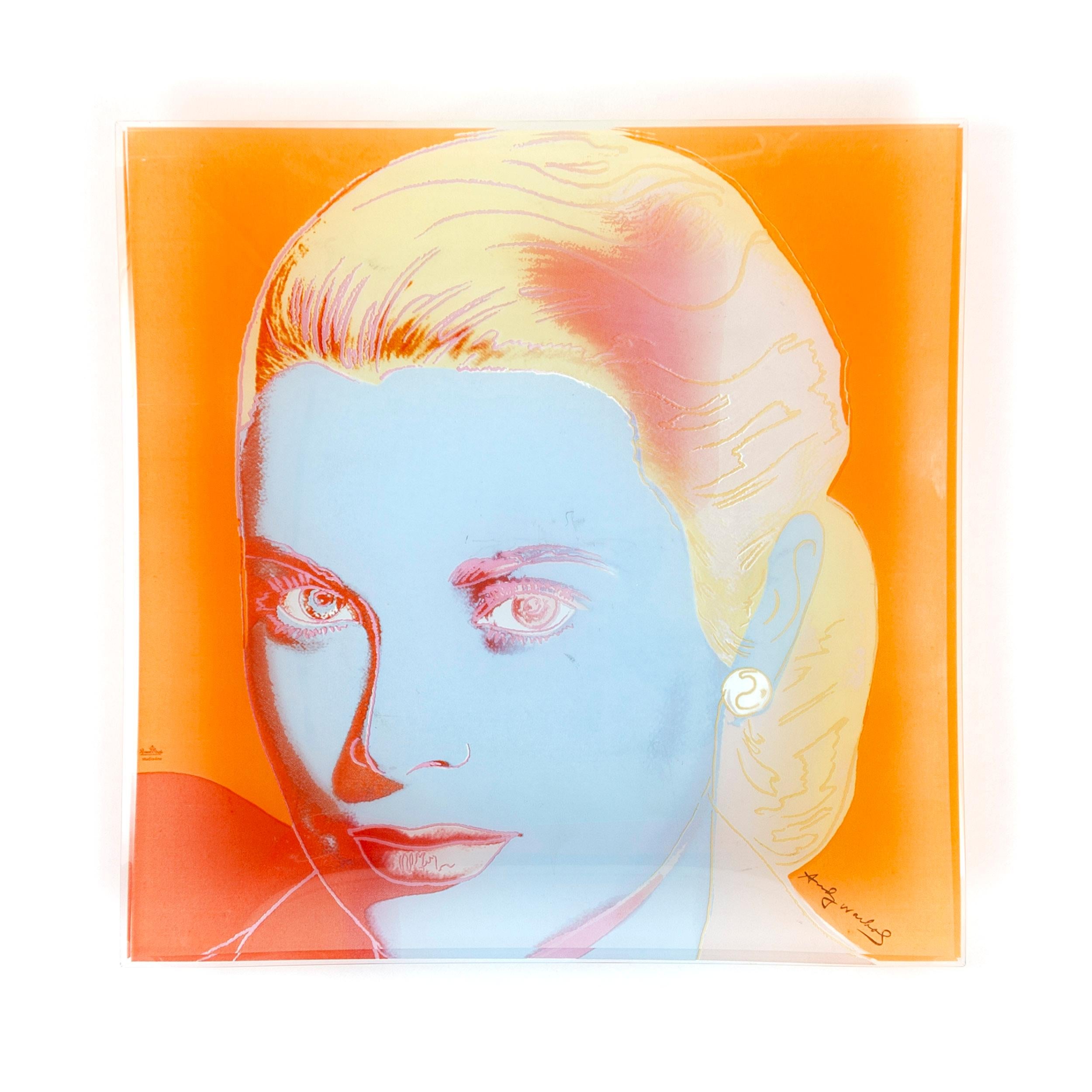 An Andy Warhol silkscreen on Rosenthal studio glass featuring the portrait of Grace Kelly.