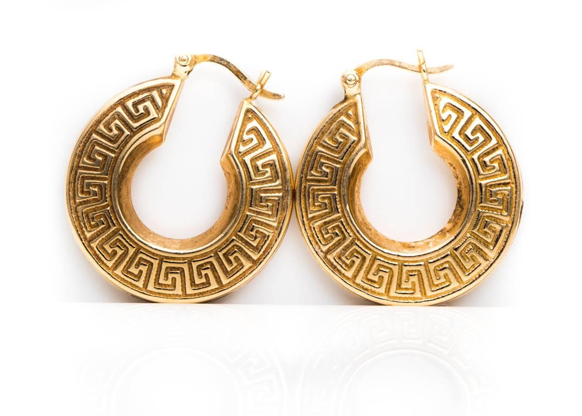 1980s 14 Karat Yellow Gold Hoop Earrings with Greek Key pattern on each side.

These classic earrings measure 2.25 centimeters in diameter and .5 centimeter wide. 
They have a hinged snap back for secure fastening and are hallmarked 585.