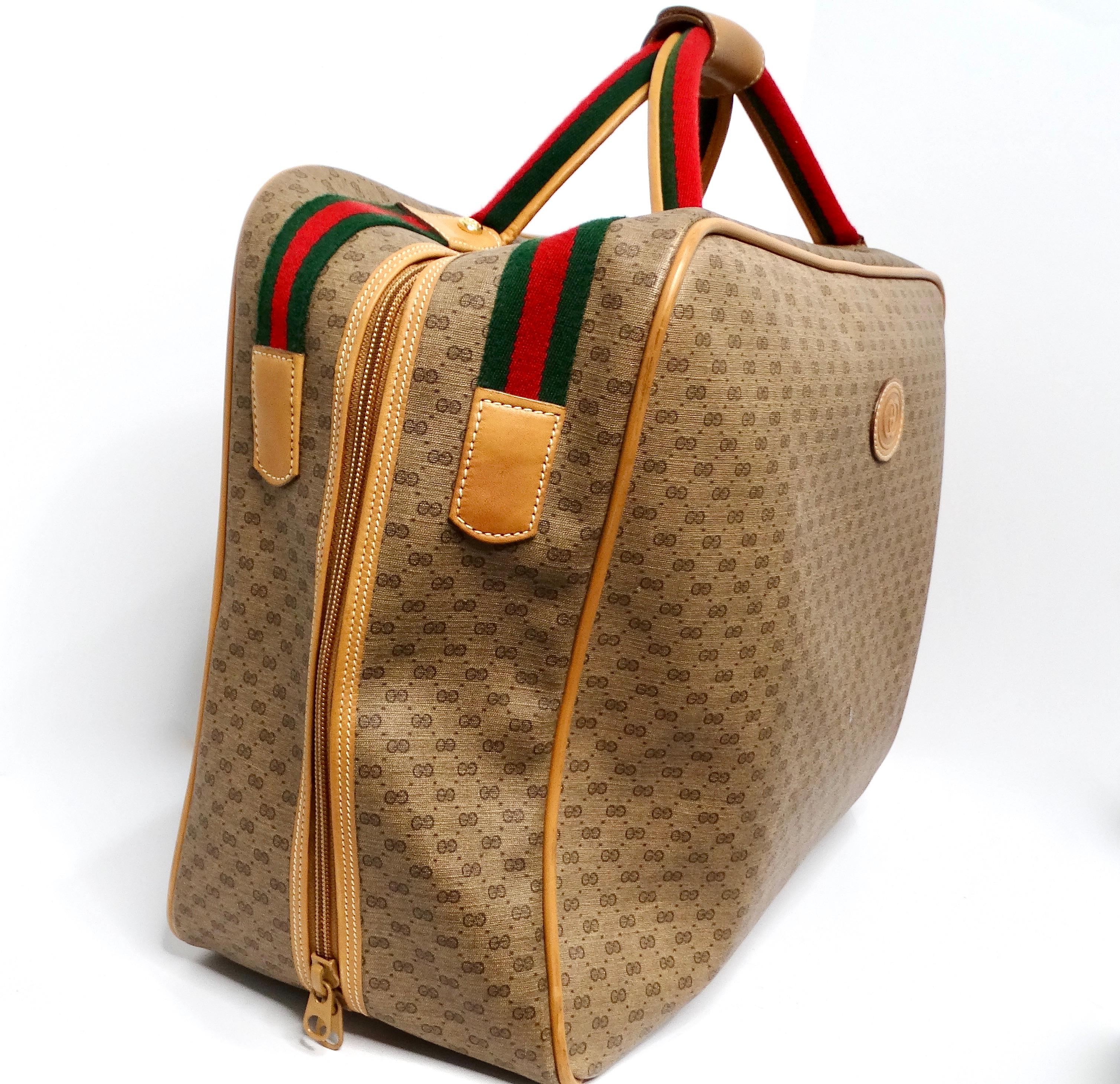 The 1980s Gucci Brown Monogram Coated Canvas Carry-On Suitcase is a quintessential piece that reflects the luxury and timeless style of its era. This stunning suitcase features Gucci's iconic monogram, complemented by the classic red and green