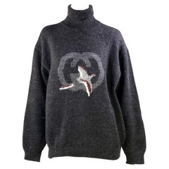 Pull à col roulé Gucci des années 1980 avec logo GG Vintage Hunting Bird pour hommes
