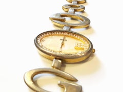 1980s Gucci gold tone brass mother of pearl wrist watch