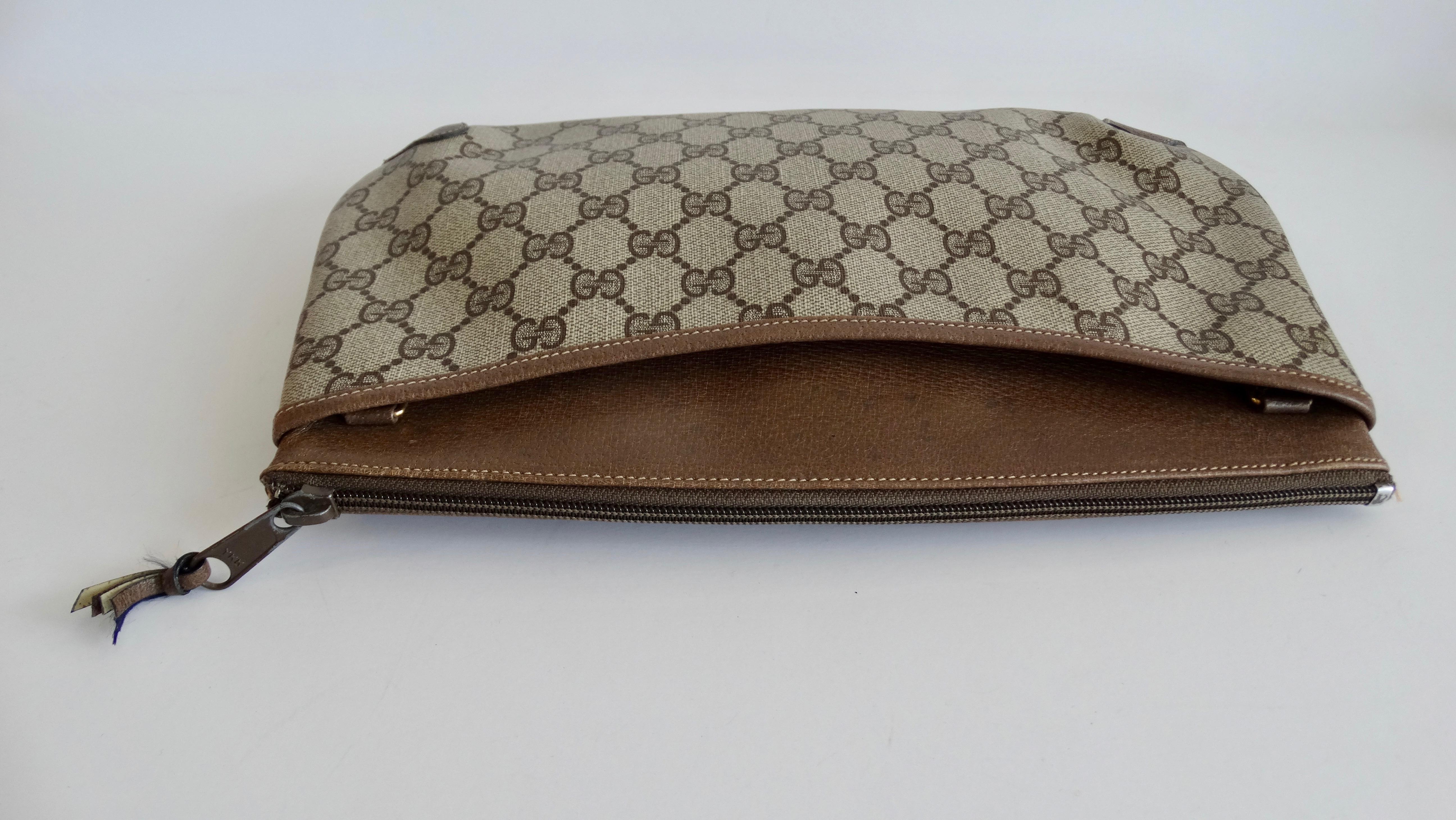 Carry around a piece of Gucci fashion history with this adorable clutch! Circa 1980s, this clutch is from Gucci's accessory collection, which launched in 1979 and produced until the early 90s. This clutch features the iconic Gucci monogram pattern,